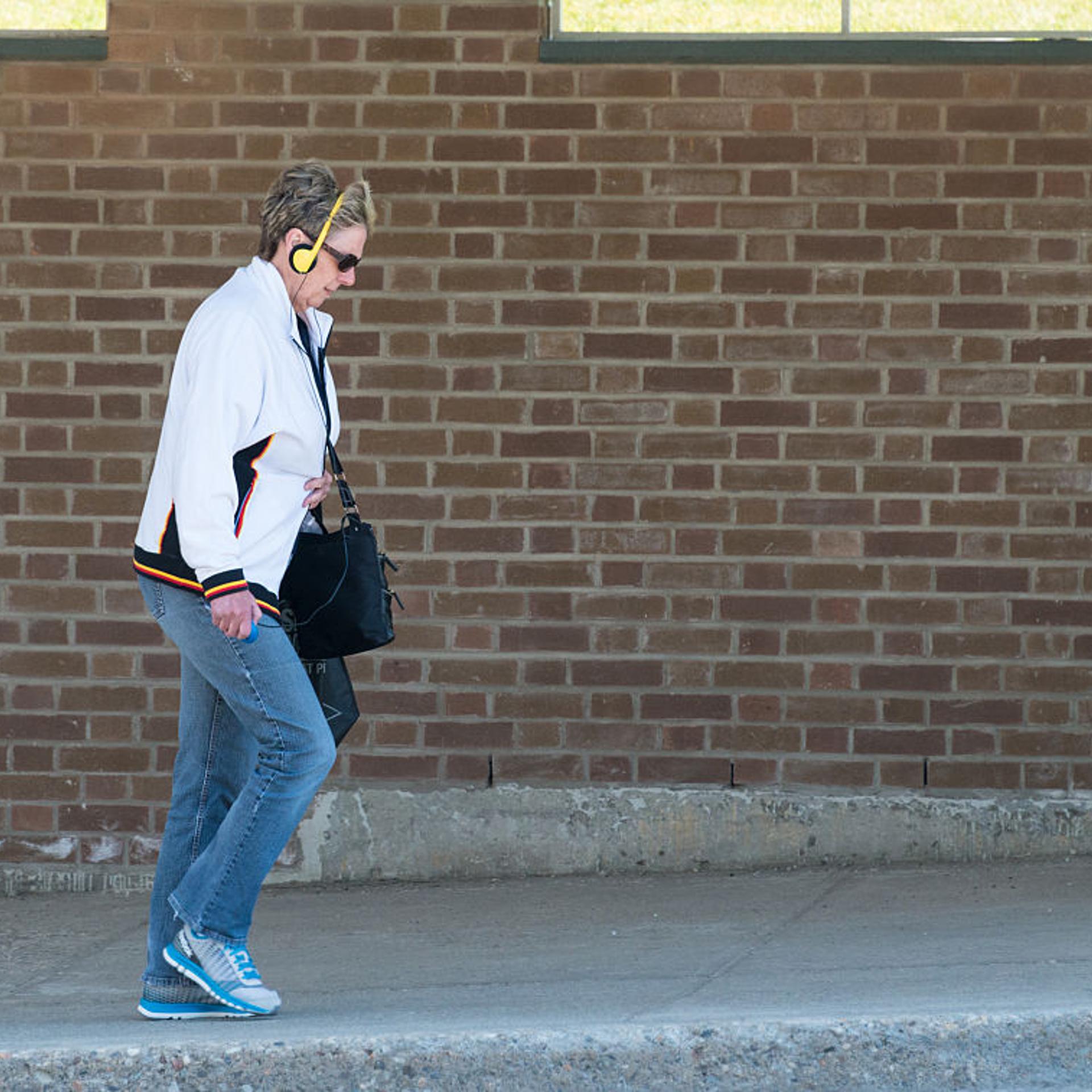 Social disconnection: Woman wearing headphones and