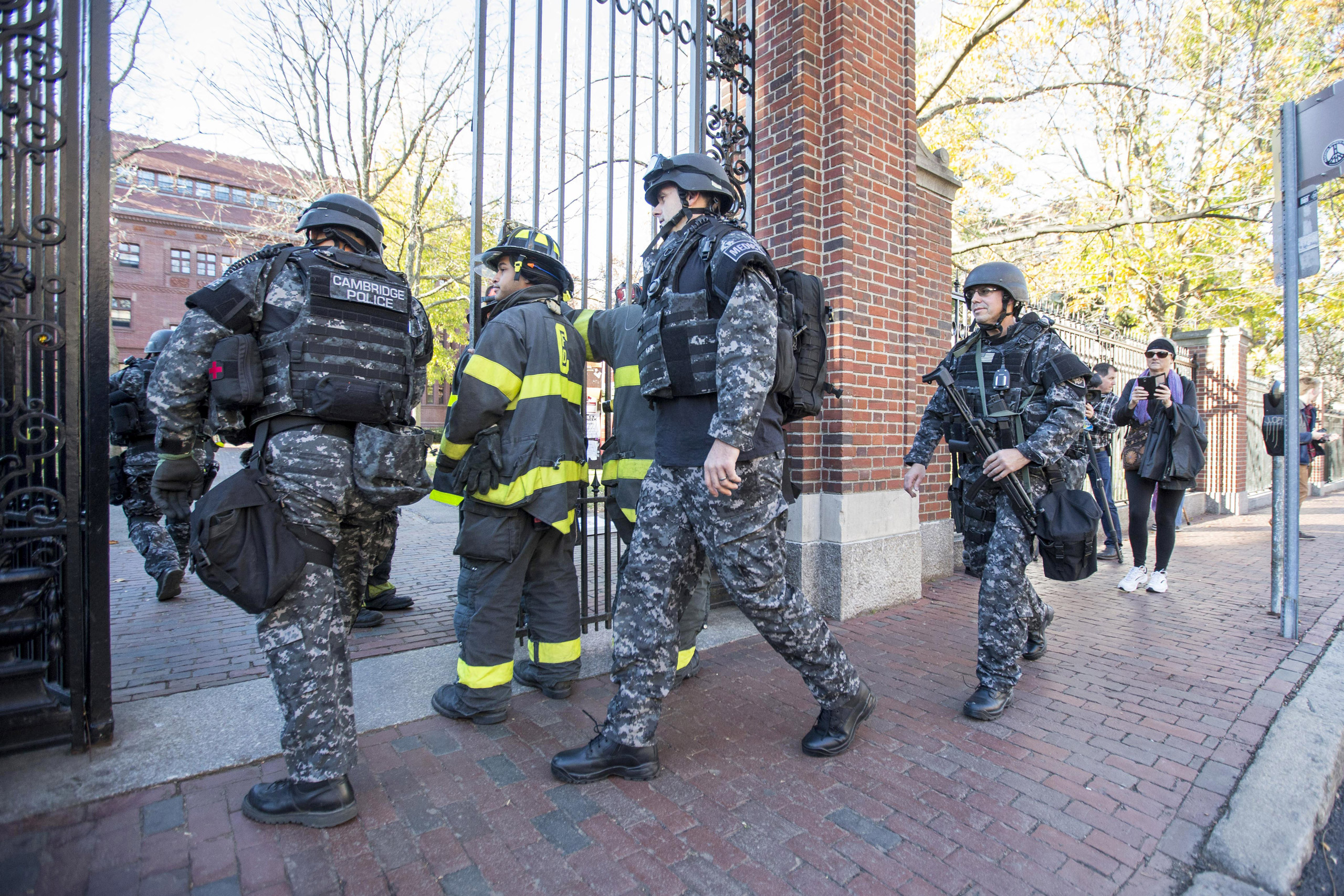 CAMBRIDGE, MA - NOVEMBER 16: Cambridge Police SWAT team members arrive at Harvard Yard following a bomb threat that was made on campus on November 16, 2015 in Cambridge, Massachusetts. Multiple buildings were evacuated and the Harvard Yard was shut down 