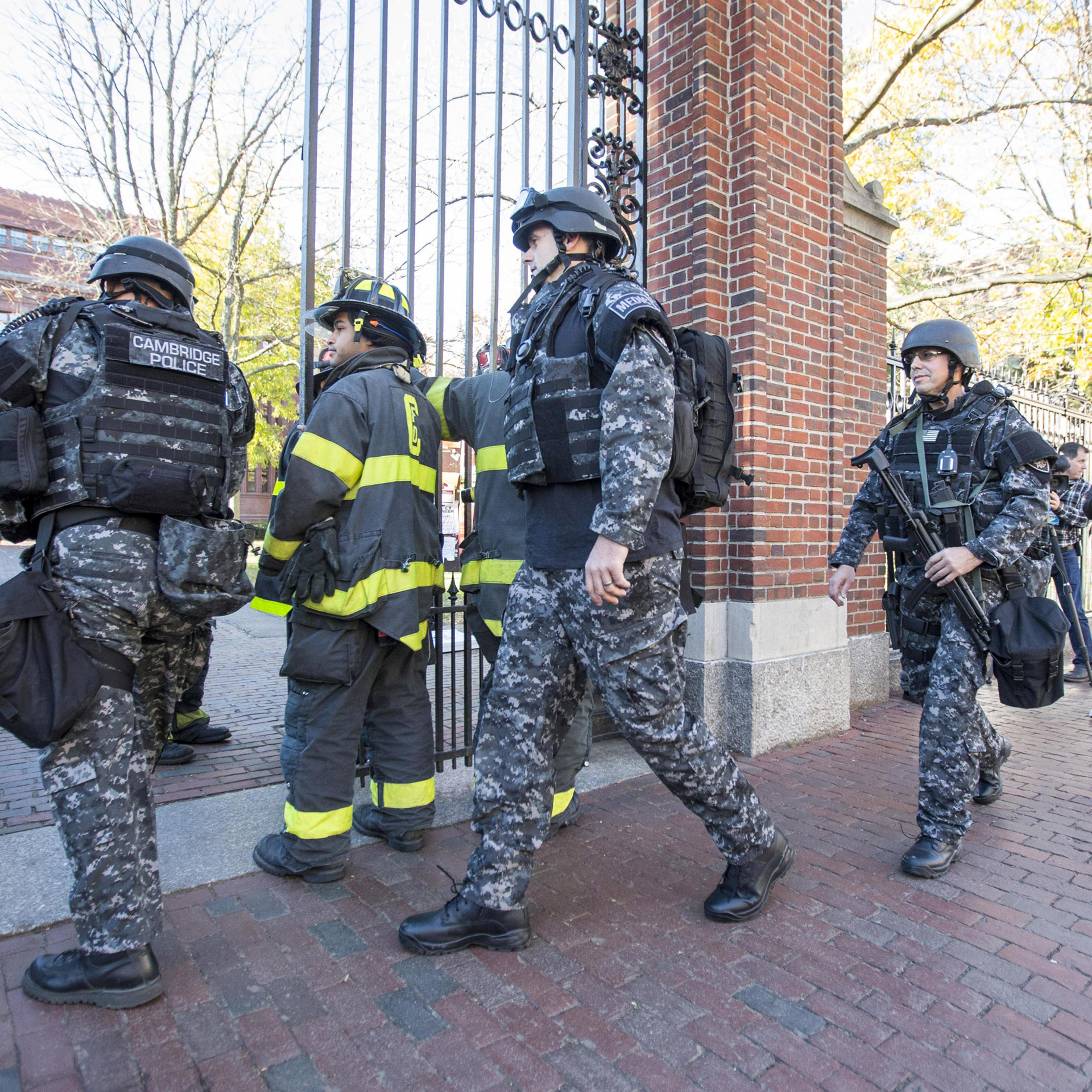 CAMBRIDGE, MA - NOVEMBER 16: Cambridge Police SWAT team members arrive at Harvard Yard following a bomb threat that was made on campus on November 16, 2015 in Cambridge, Massachusetts. Multiple buildings were evacuated and the Harvard Yard was shut down