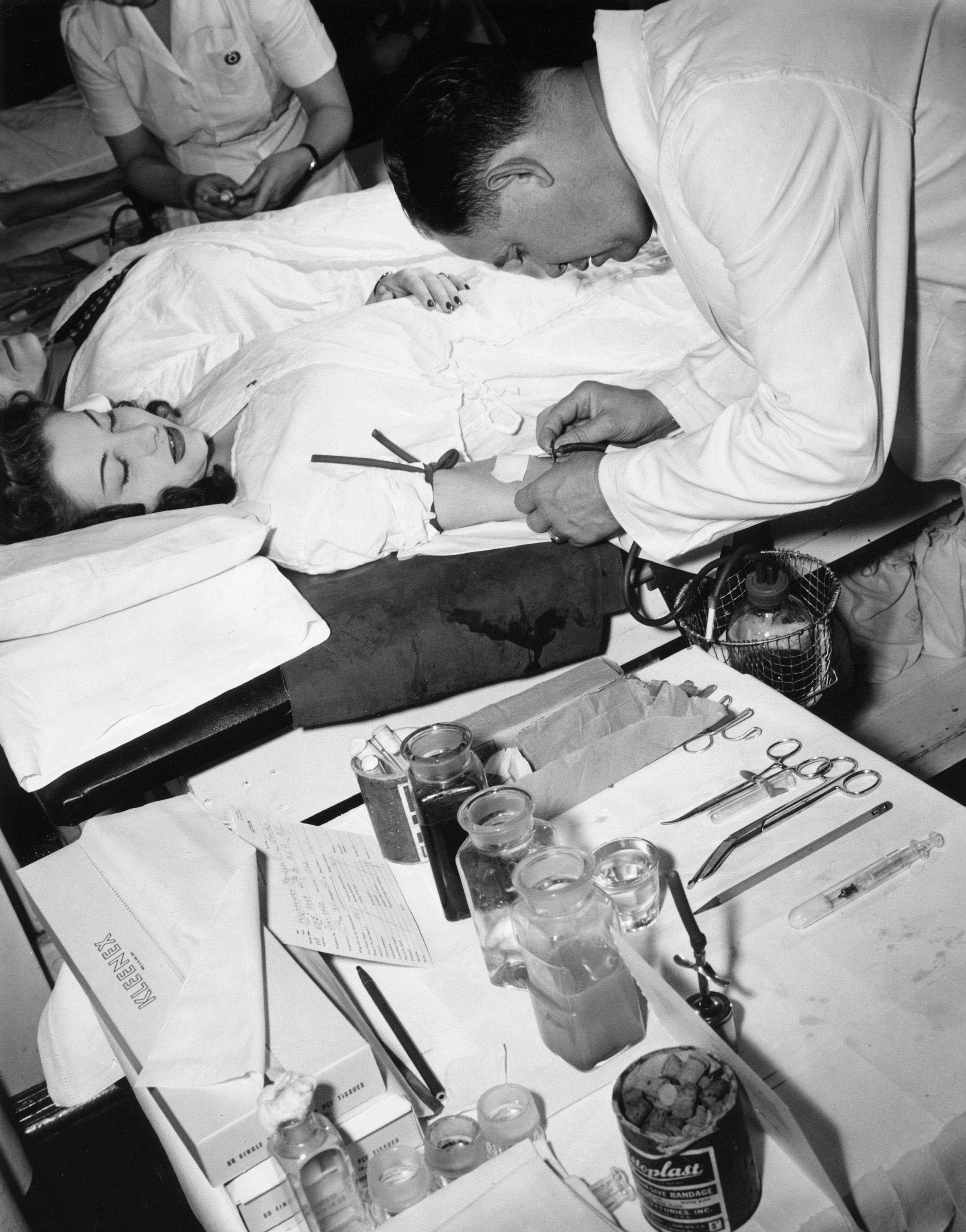 Woman donating blood to the Red Cross Blood Bank in New York City in 1943 during World War II. 
