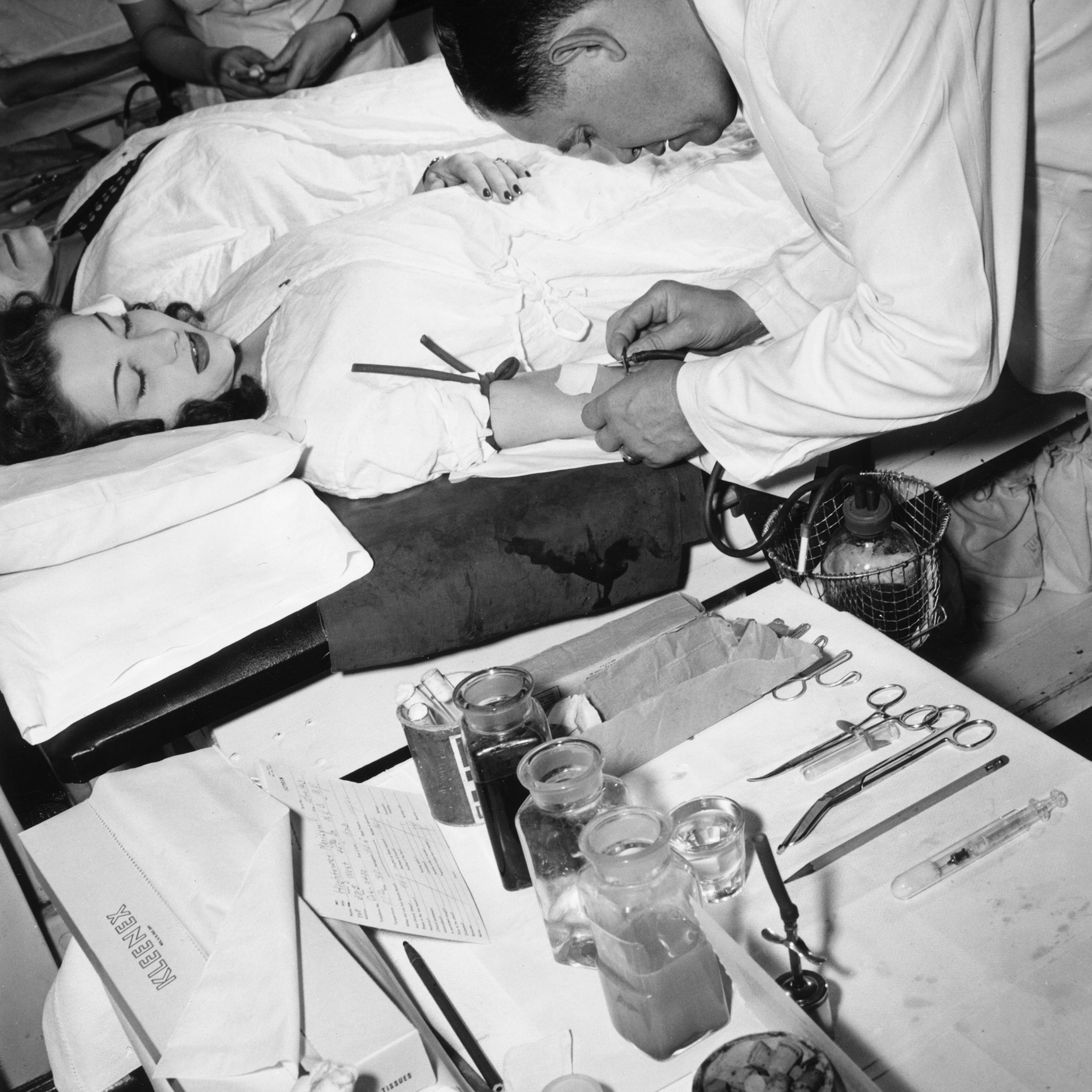 Woman donating blood to the Red Cross Blood Bank in New York City in 1943 during World War II.