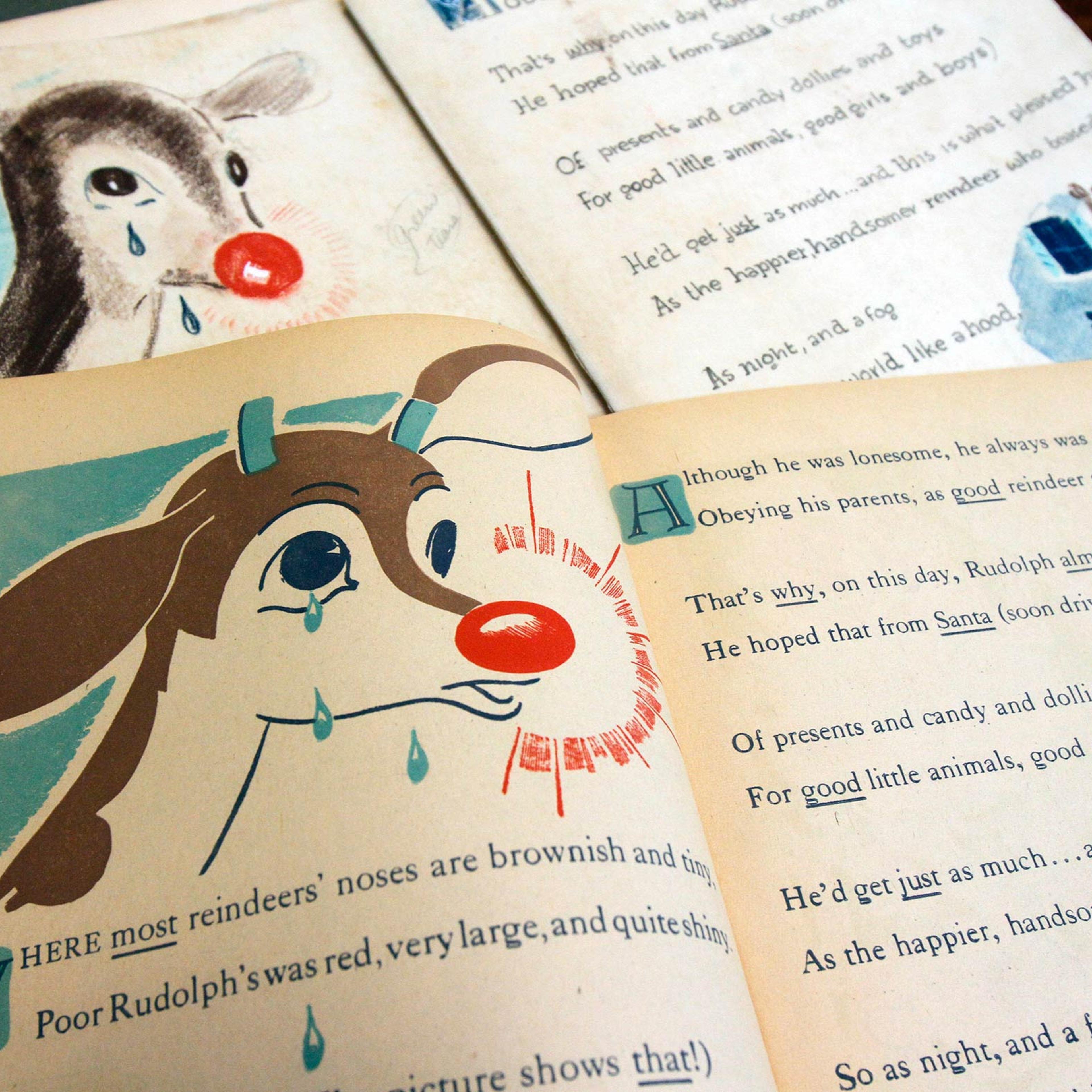 A first edition of "Rudolph, the Red-Nosed Reindeer", bottom, and an original layout, top, on Dec. 20, 2011, at Dartmouth College in the Rauner Special Collections Library in Hanover, N.H.