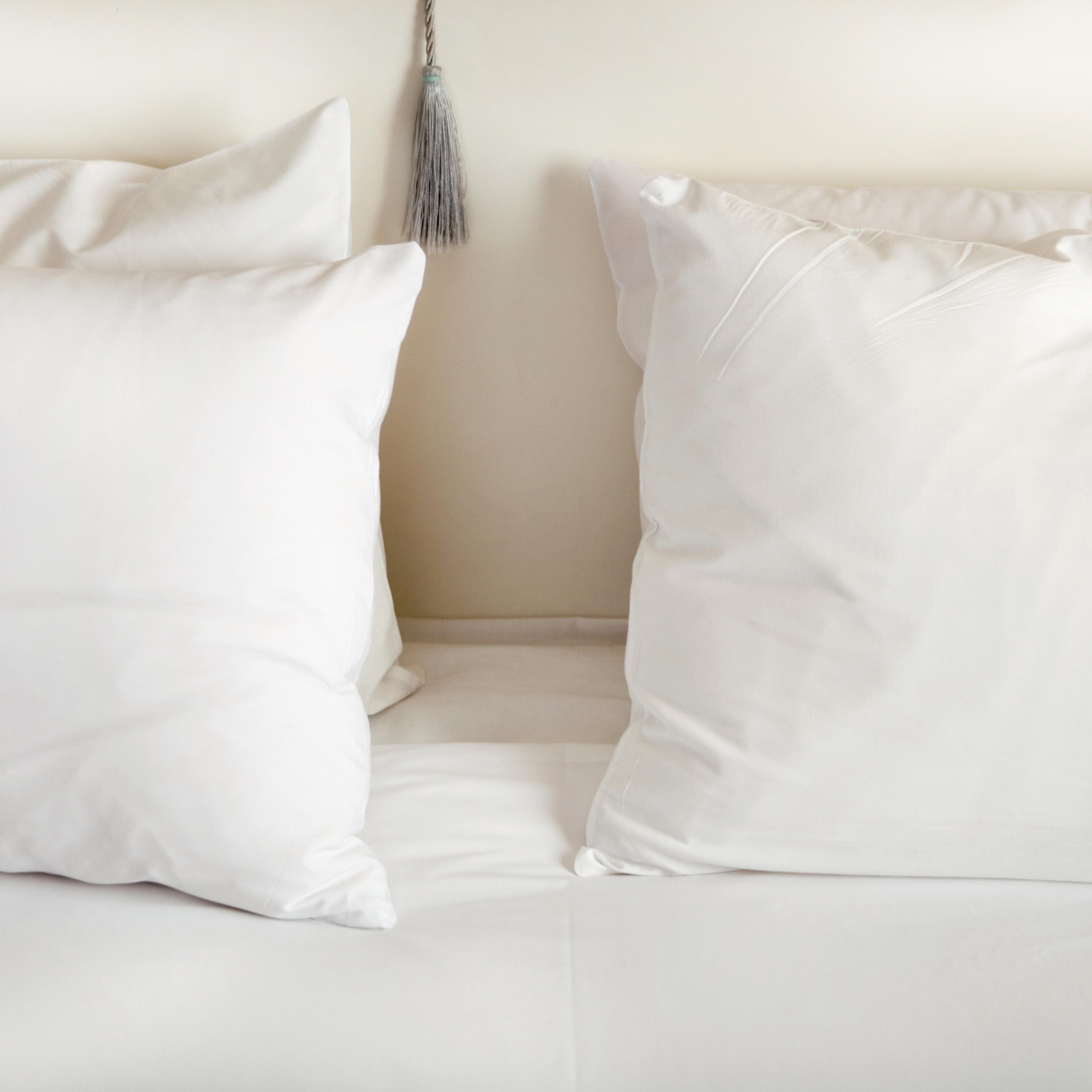 White pillows on bed