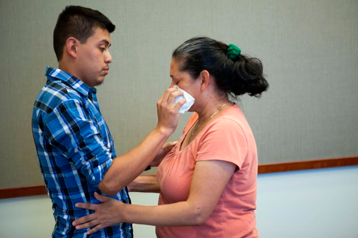 Steve Hernandez wipes a tear from his mother's eye after seeing her for the first time in 20 years in San Diego, Calif., on Thursday, June 9, 2016. Steve Hernandez was abducted by his father Valentin Hernandez from their Rancho Cucamonga residence in 199