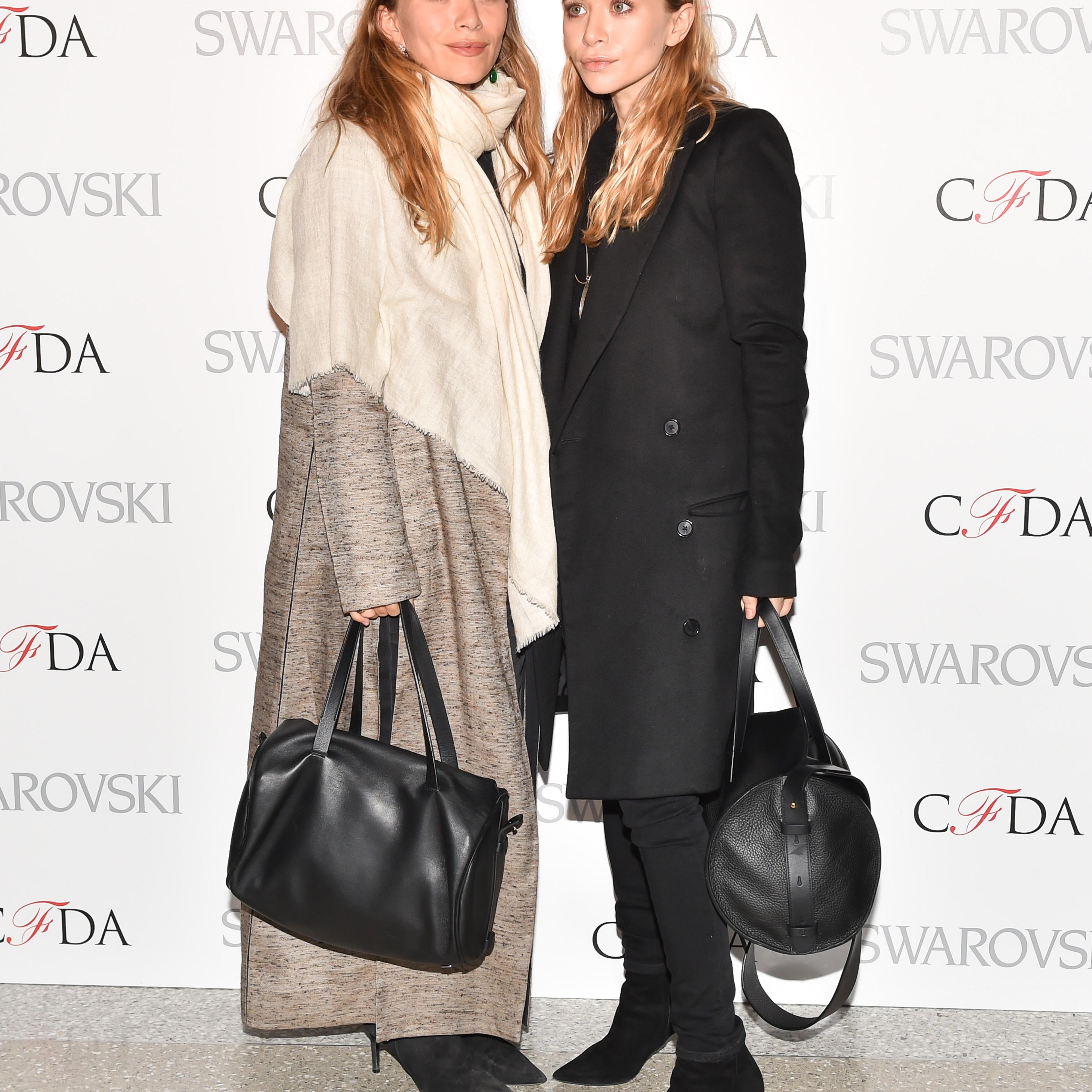 Mary-Kate Olsen (L) and Ashley Olsen attend 2015 CFDA Fashion Awards Announcement Party in New York City on March 16, 2015.