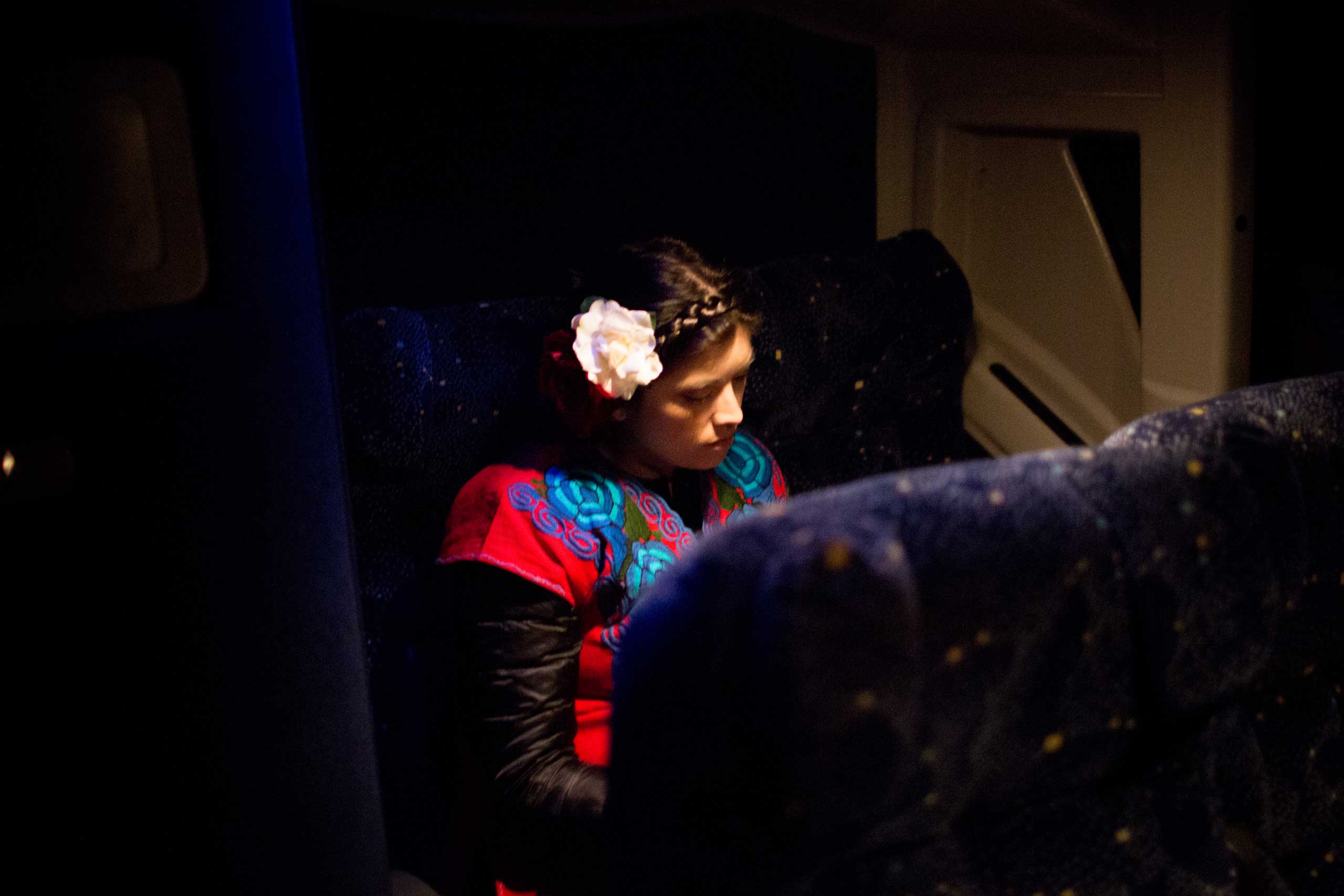 5:33 AM: Karina Garcia, 31, is one of the main organizers of the Answer Coalition event. As we approach D.C., she takes a moment to rest.