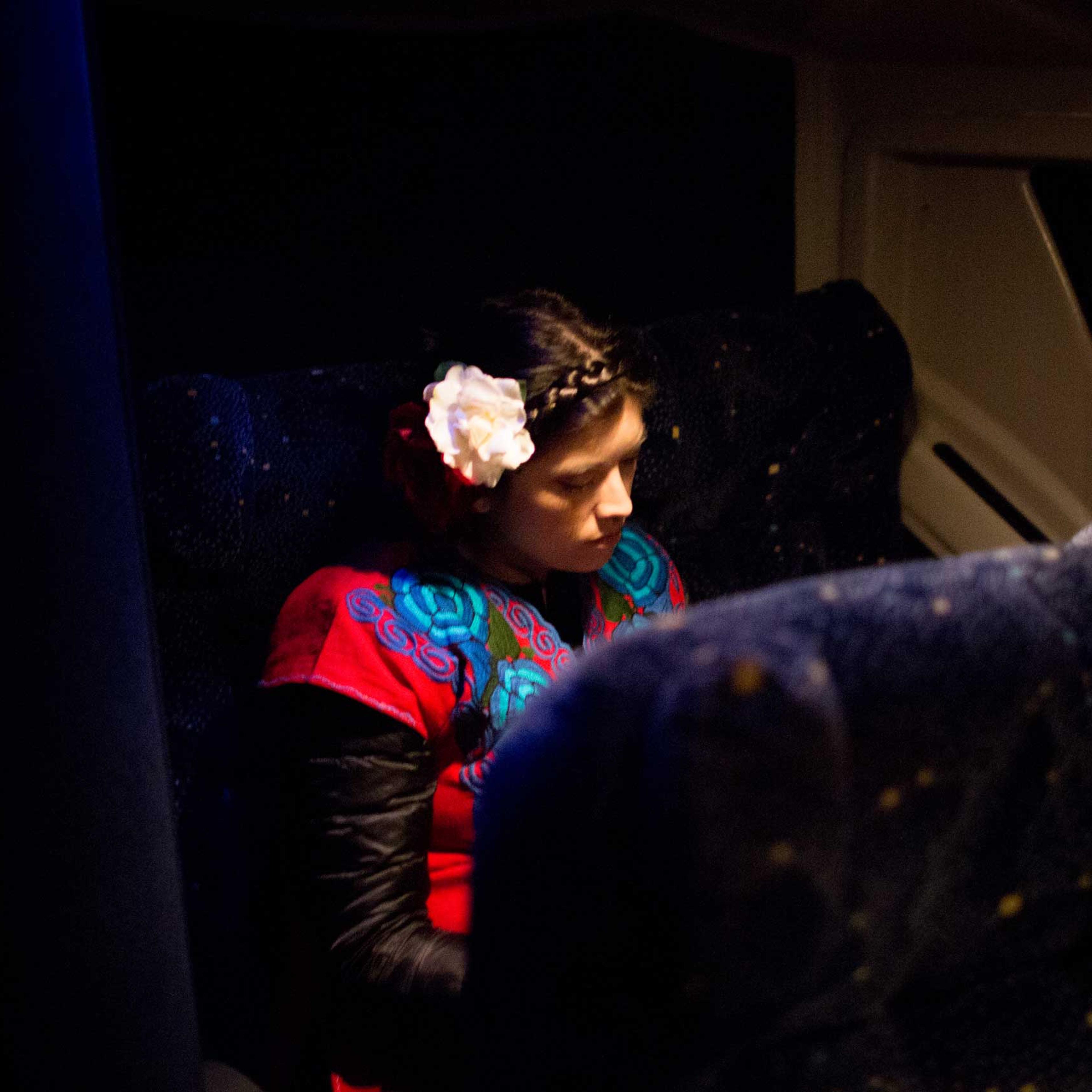 5:33 AM: Karina Garcia, 31, is one of the main organizers of the Answer Coalition event. As we approach D.C., she takes a moment to rest.