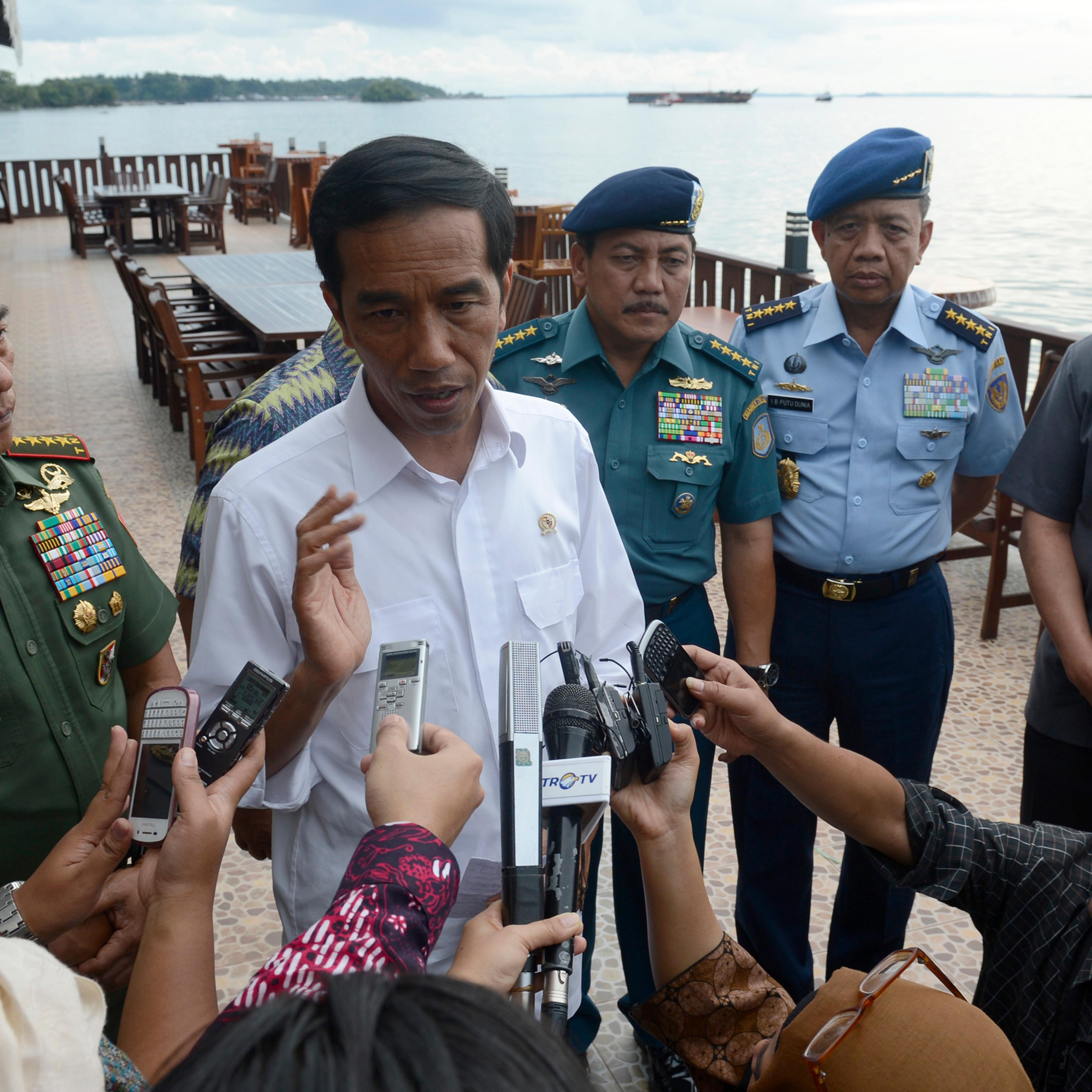 Indonesian President Joko Widodo speaks to the media about AirAsia Flight QZ8501 in Sorong, West Papua,