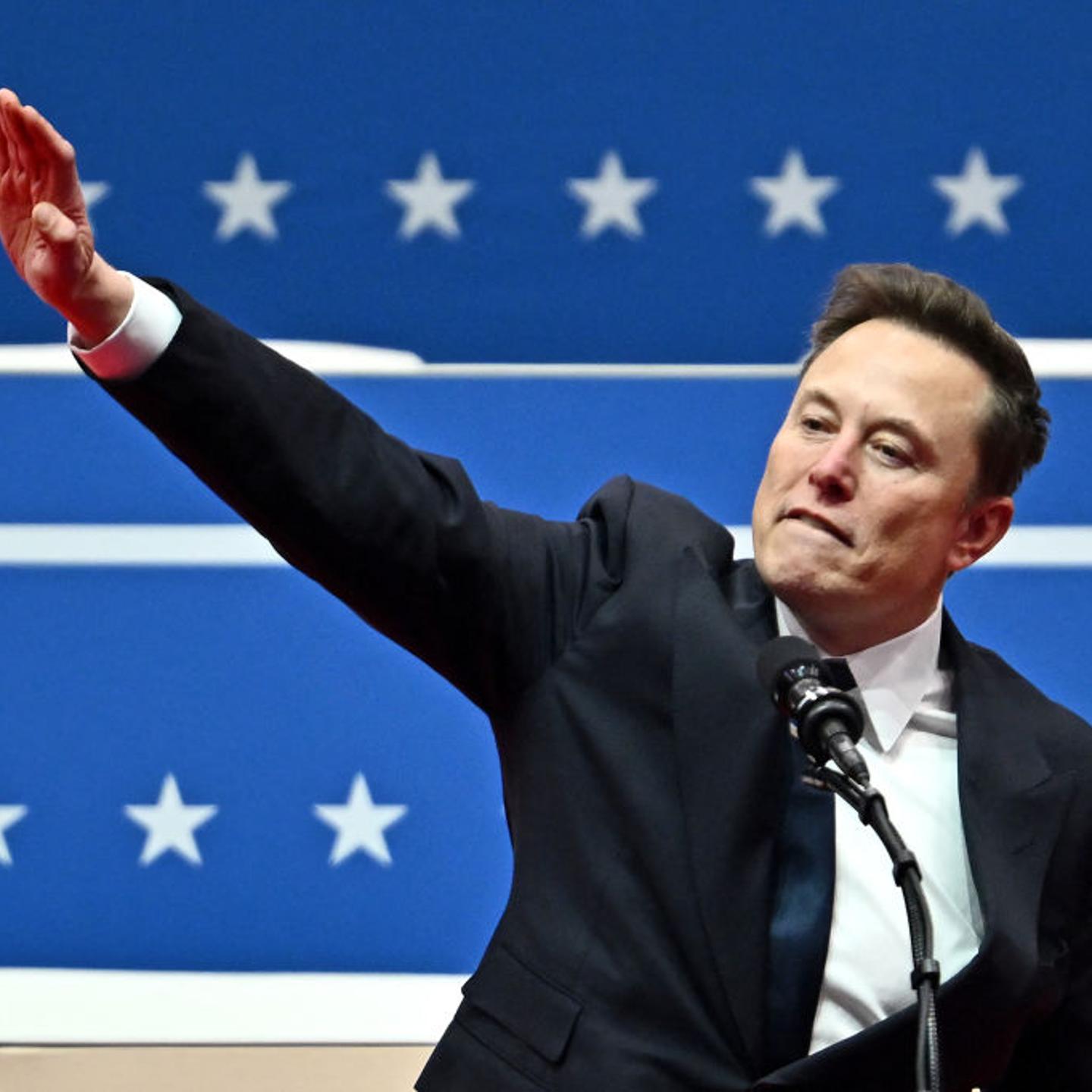 Tesla and SpaceX CEO Elon Musk gestures as he speaks during the inaugural parade inside Capital One Arena, in Washington, DC, on Jan. 20, 2025.