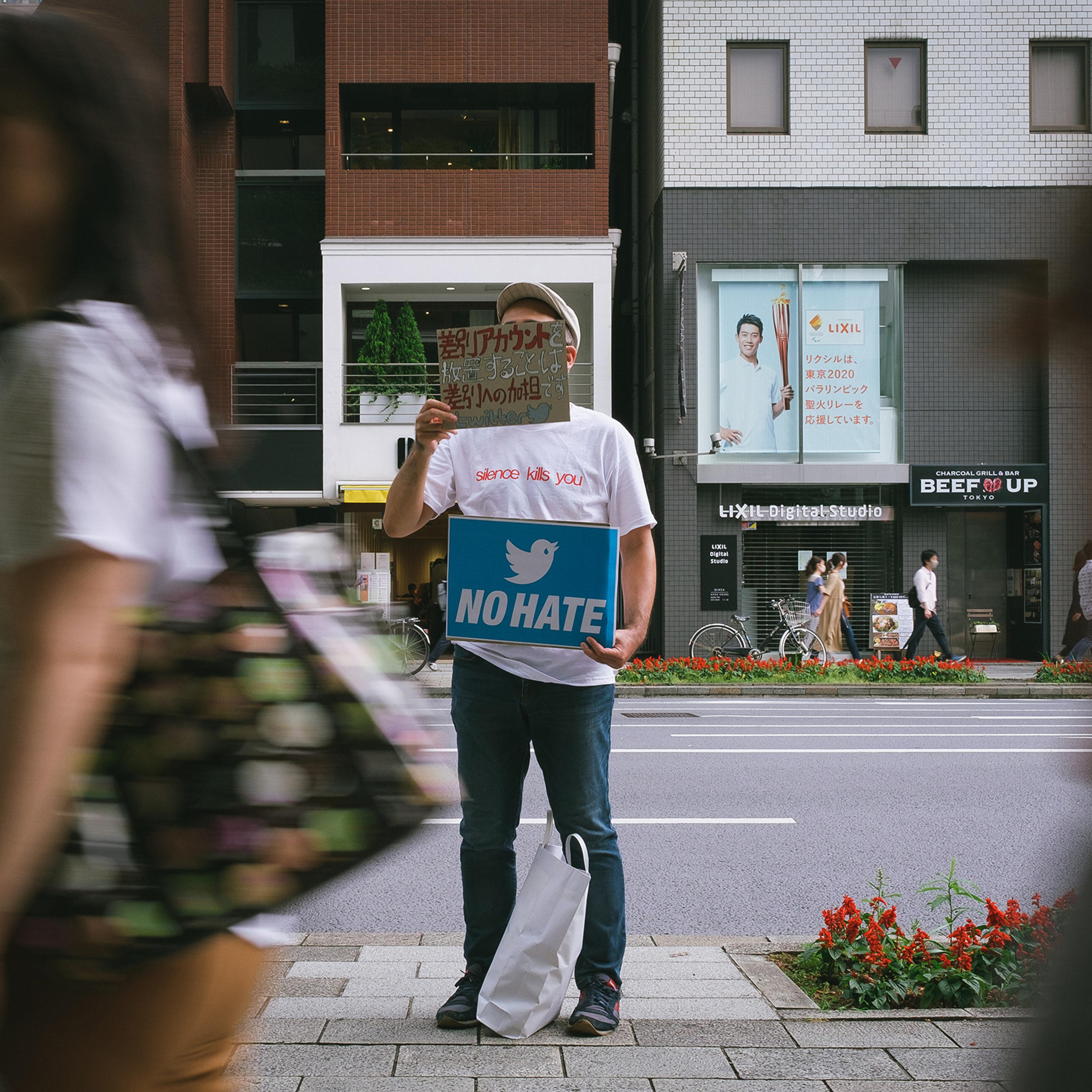 People gather in front of Twitter Japan headquarters in Tokyo to pressure the company to be more active against hate speech and discrimination on the platform, June 6, 2020.