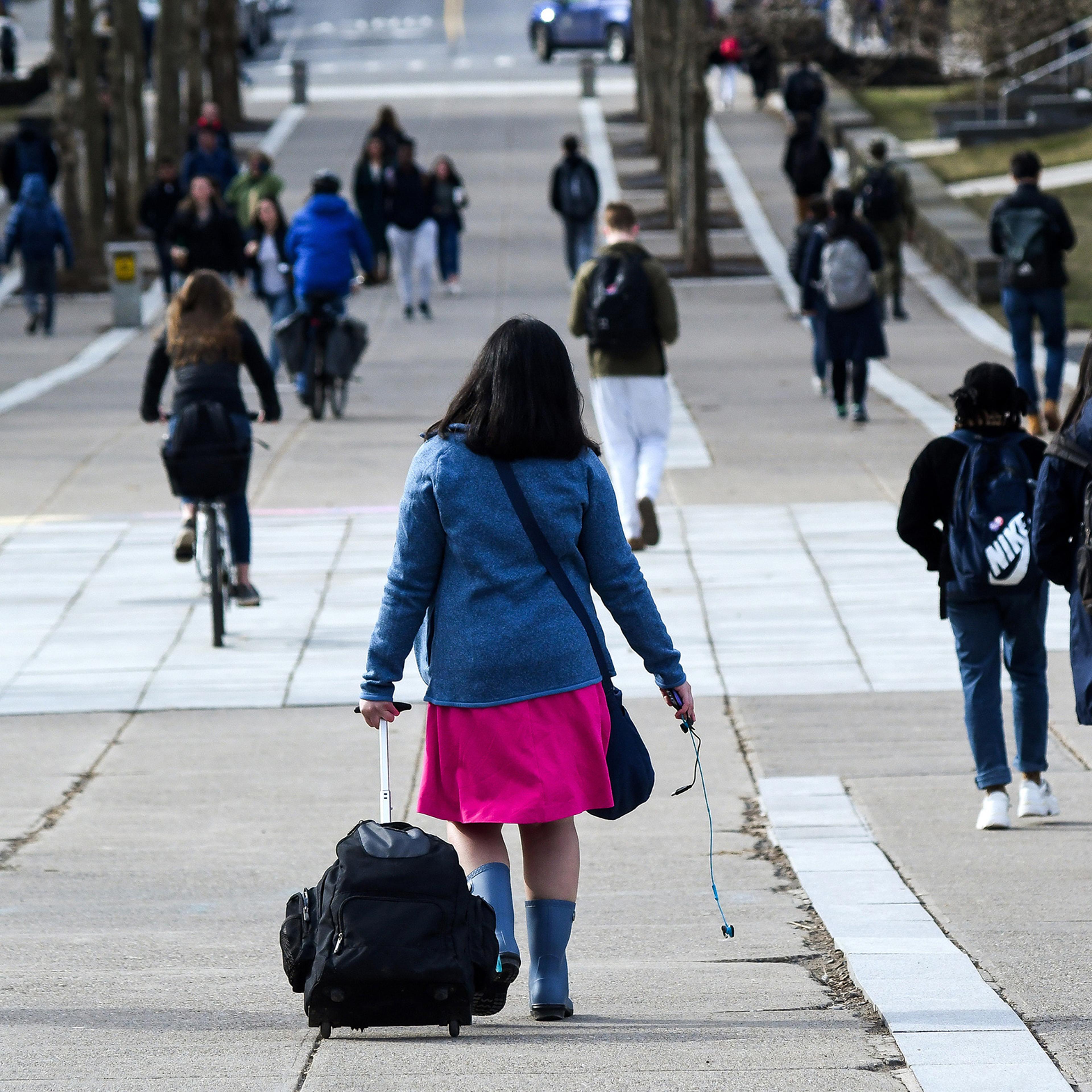 Students walk along Ho Plaza at Cornell University in Ithaca, N.Y. on March 11.