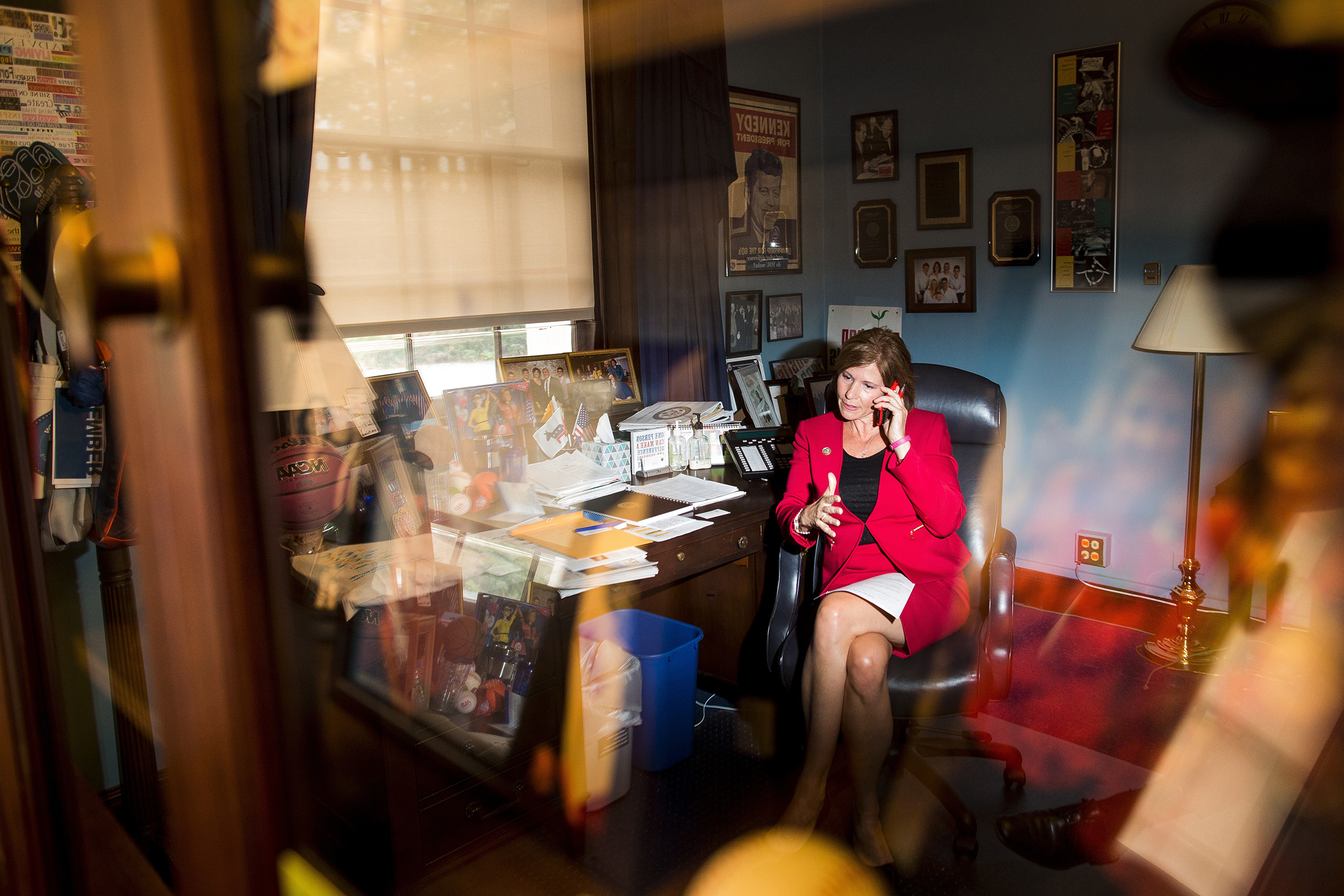 Bustos works the phone at her office on Capitol Hill in May 2017