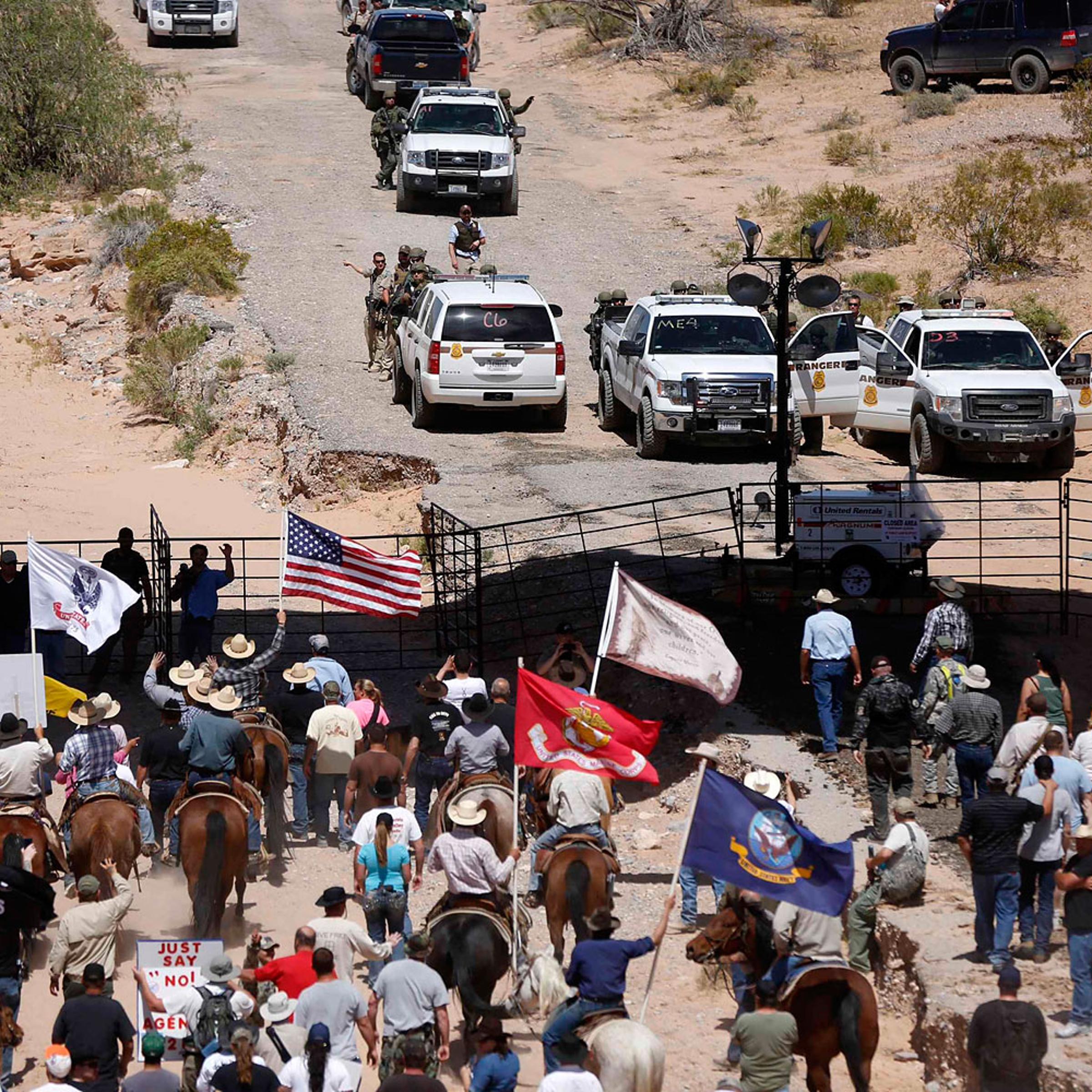 Protesters gathered at the Bureau of Land Management's base camp, where cattle that were seized from rancher Cliven Bundy was being held, near Bunkerville, Nevada, April 12, 2014.
