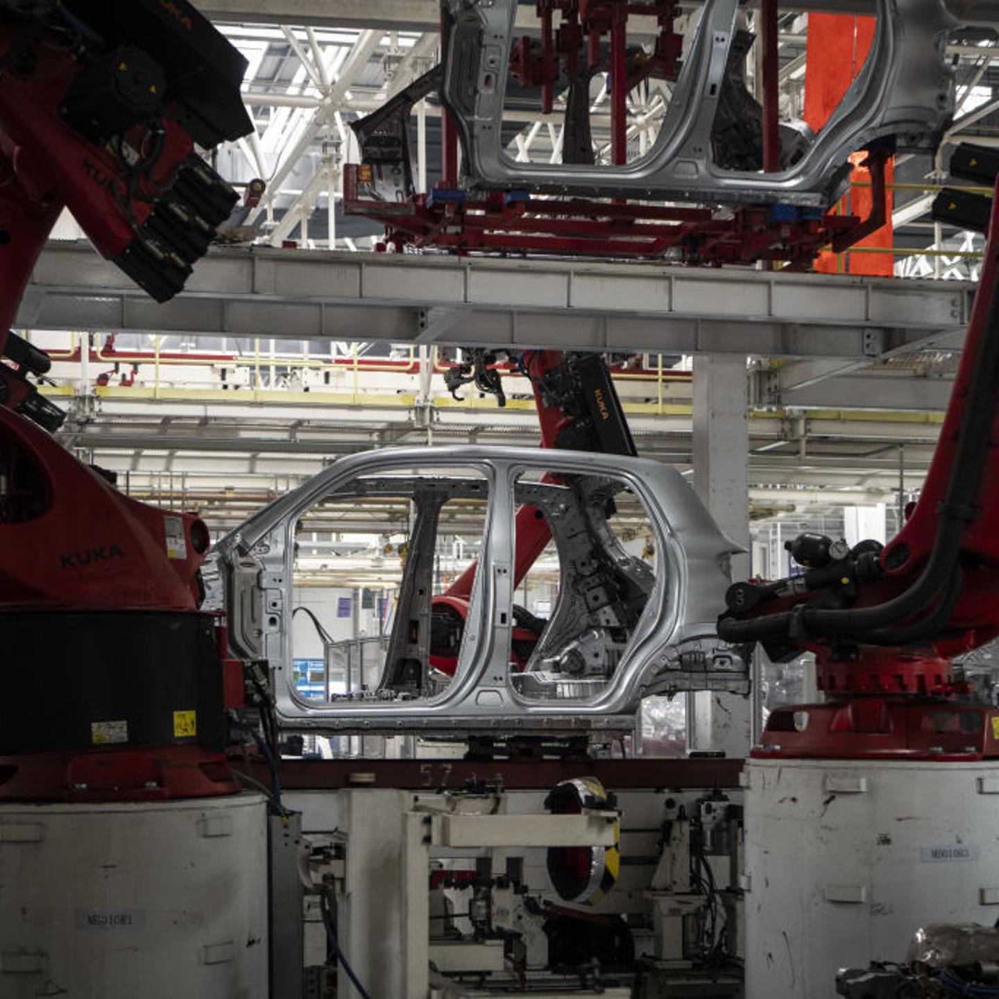 Robotic arms on the assembly line at the Zhejiang Leapmotor Technology Co. production facility in Jinhua, Zhejiang province, China, on June 23, 2024.