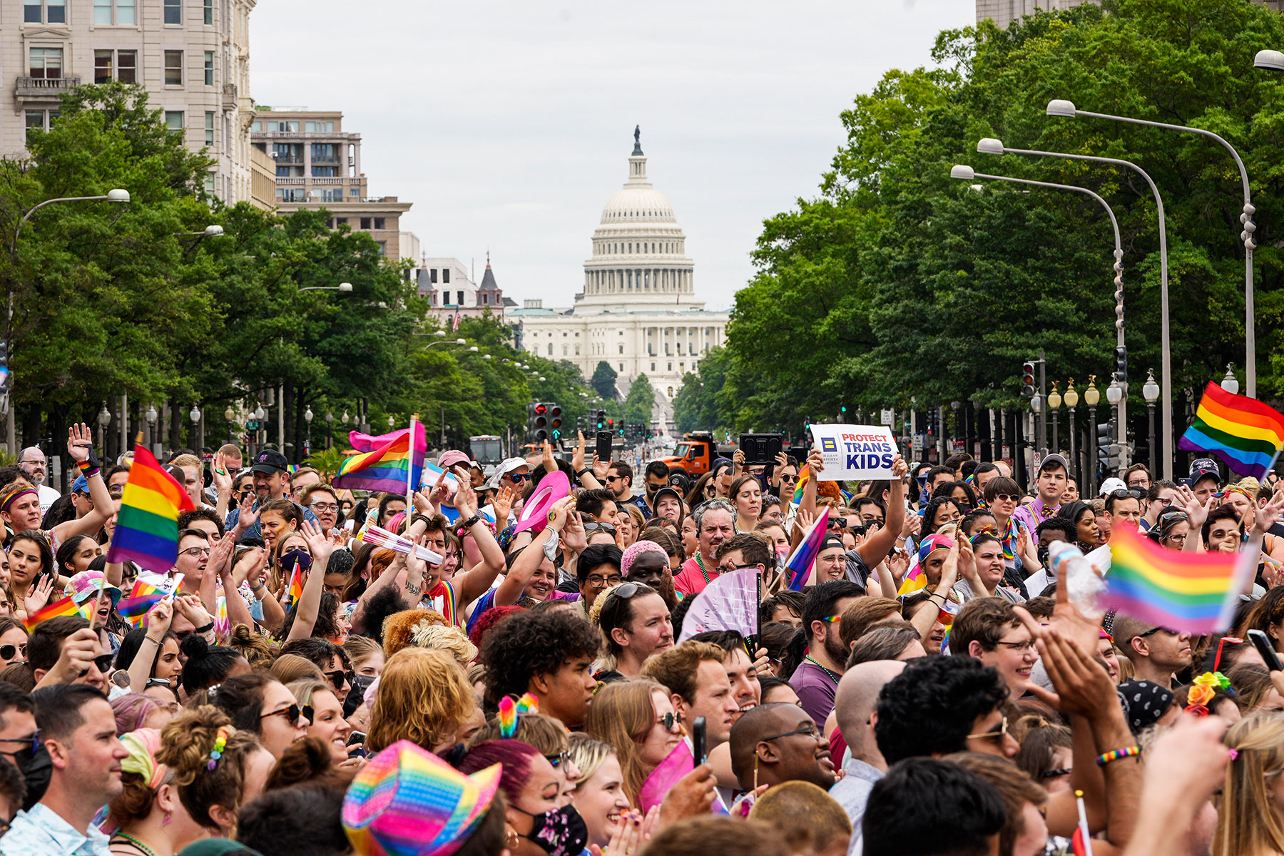Participants in a Pride rally march through downtown Washington on June 12