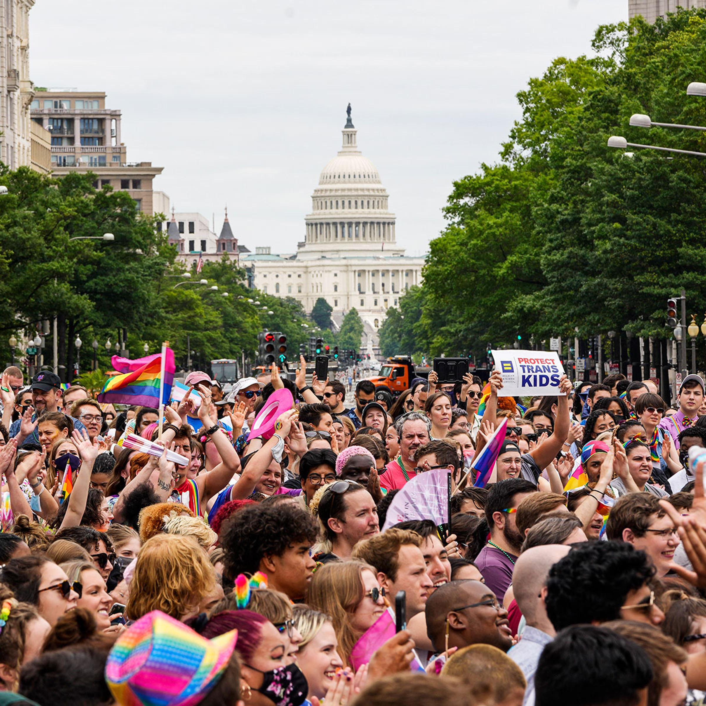 Participants in a Pride rally march through downtown Washington on June 12