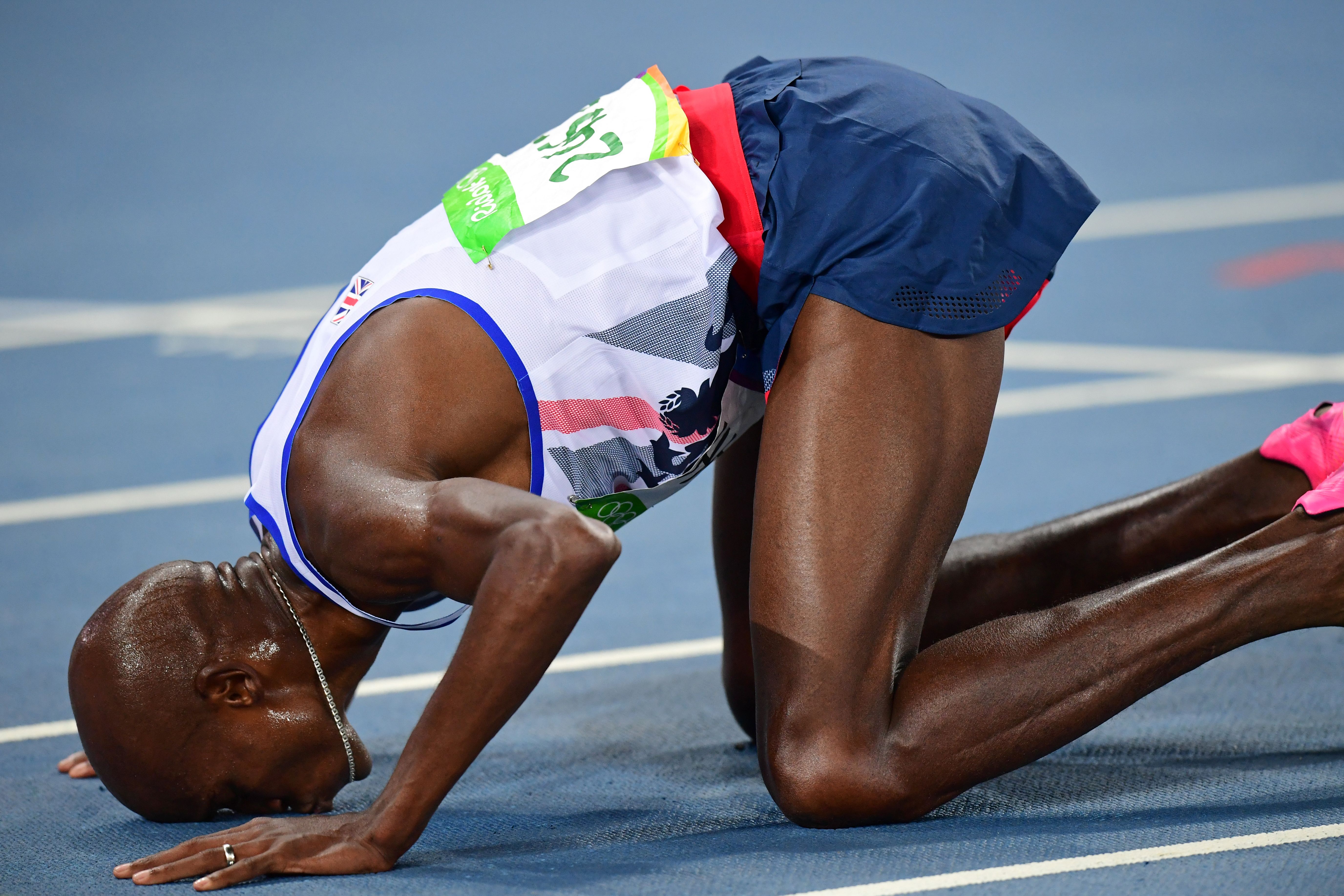 Britain's Mo Farah celebrates winning the Men's 10,000m during the athletics event at the Rio 2016 Olympic Games at the Olympic Stadium in Rio de Janeiro on Aug. 13, 2016.
