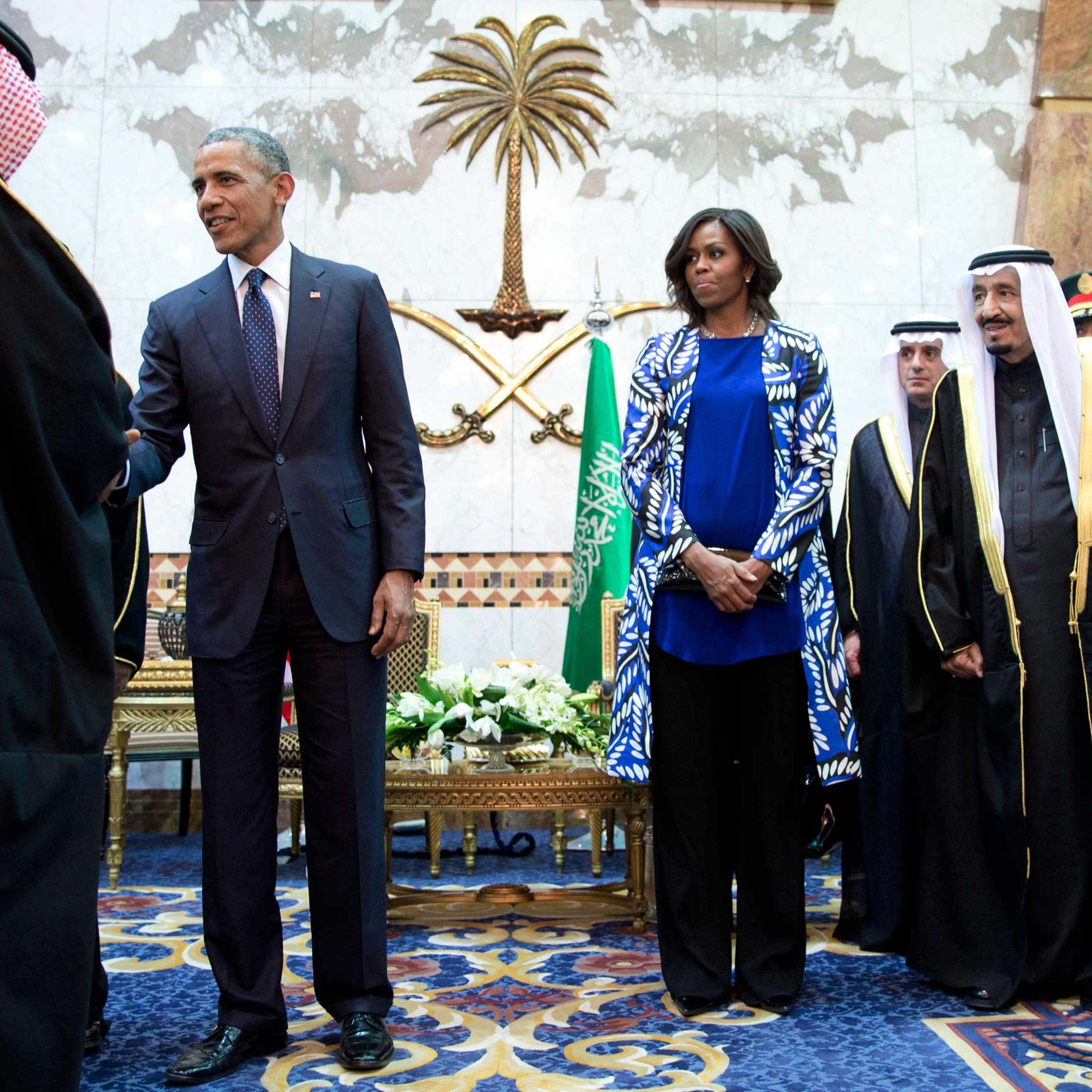 President Barack Obama and First Lady Michelle Obama participate in a delegation receiving line with new Saudi Arabian King, Salman bin Abdul Aziz, right, in Riyadh, Jan. 27, 2015.