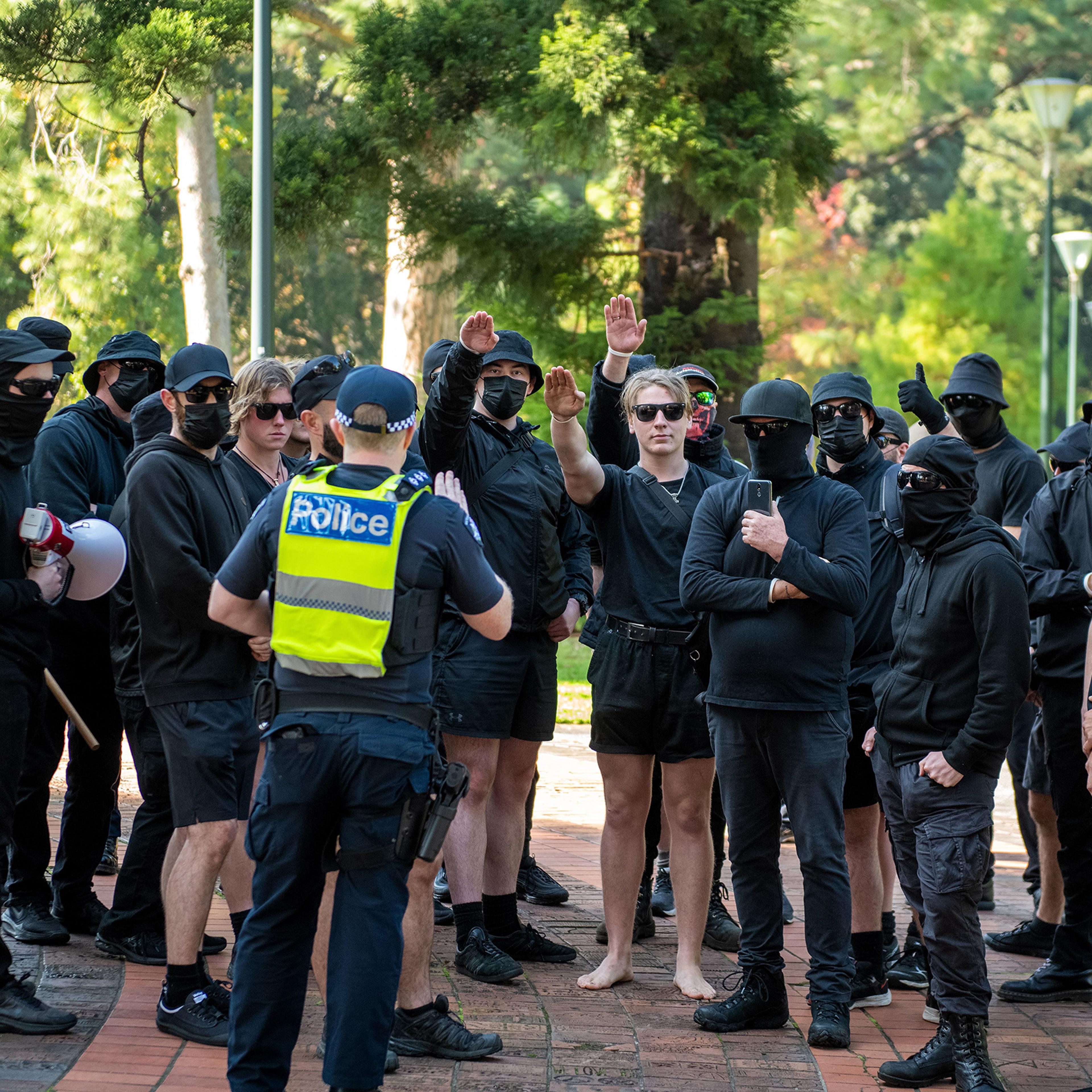 A police inspector tries to order neo-Nazis to leave the area during a heated political rally against racism, as far-right neo-Nazi groups held a demonstration at state parliament, leading to clashes and scuffles on May 13 in Melbourne, Australia.