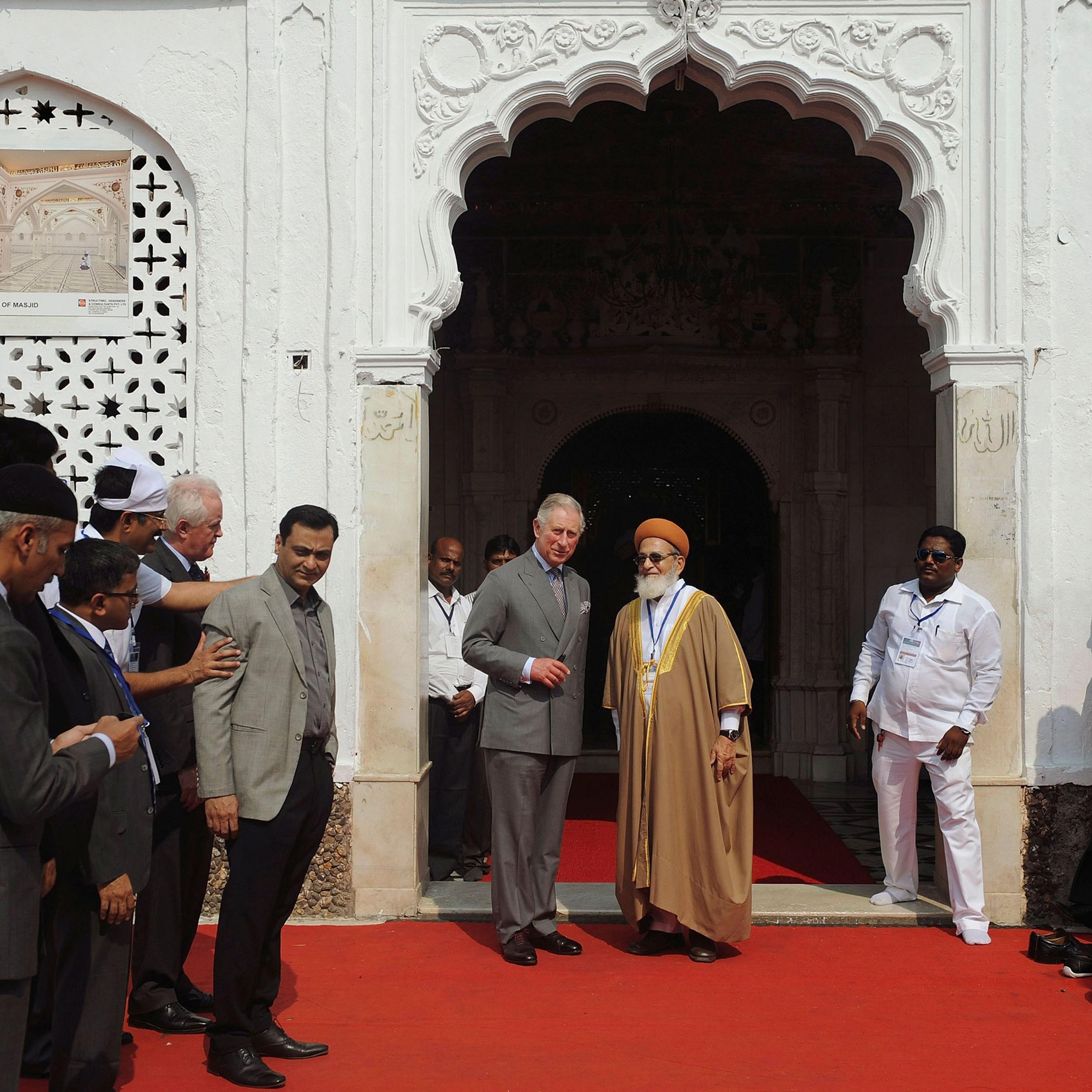 King Charles III, center left, stands with an Indian Muslim cleric at the Haji Ali Dargah in Mumbai, India