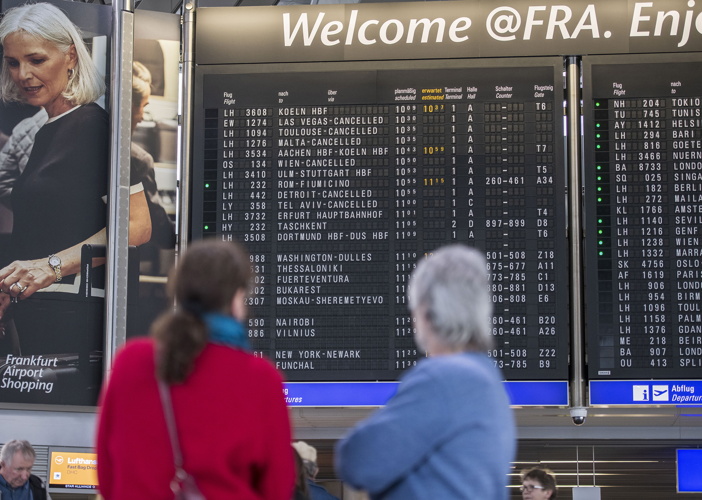 The destination board shows cancelled flights to America and Israel at Frankfurt Airport on March 12.