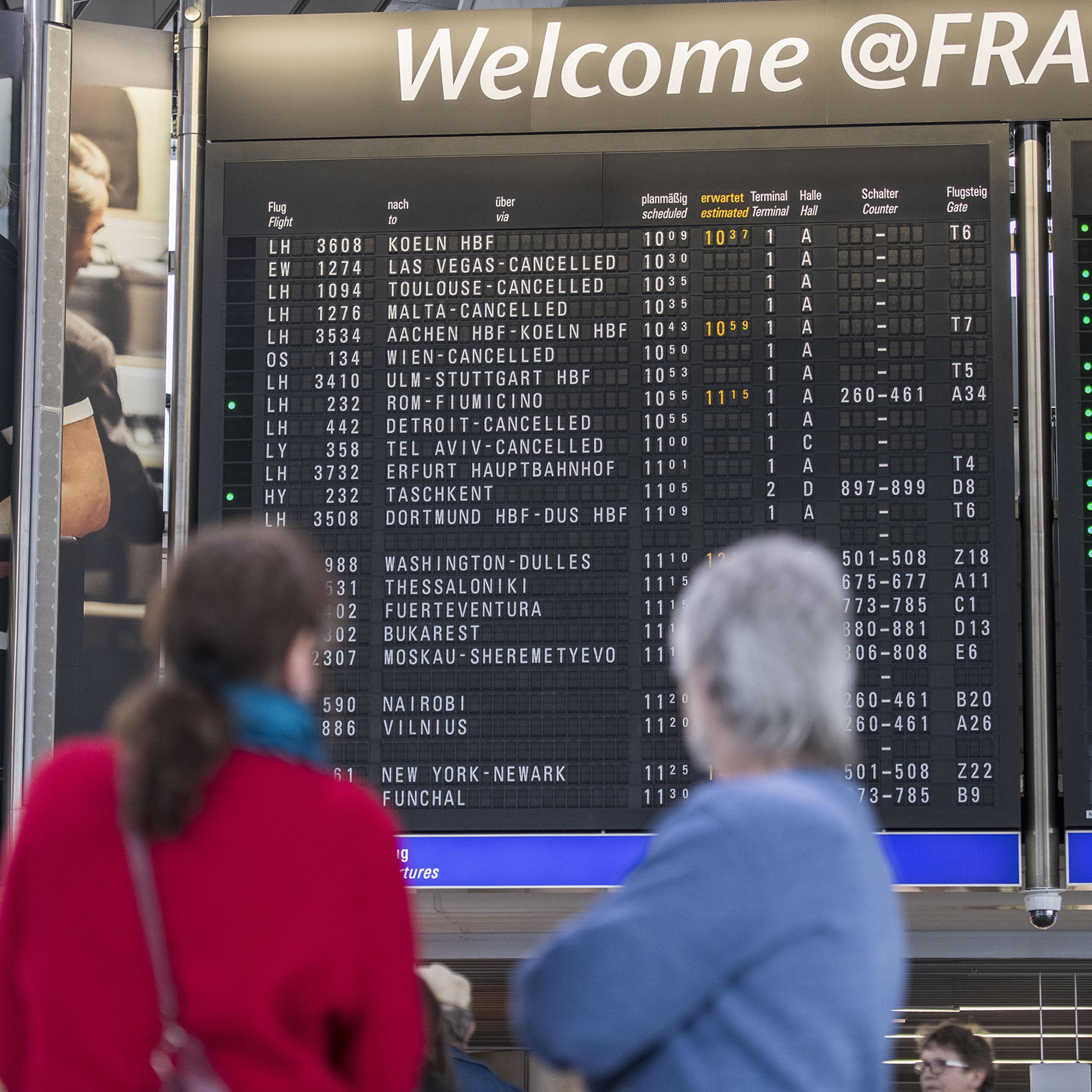The destination board shows cancelled flights to America and Israel at Frankfurt Airport on March 12.