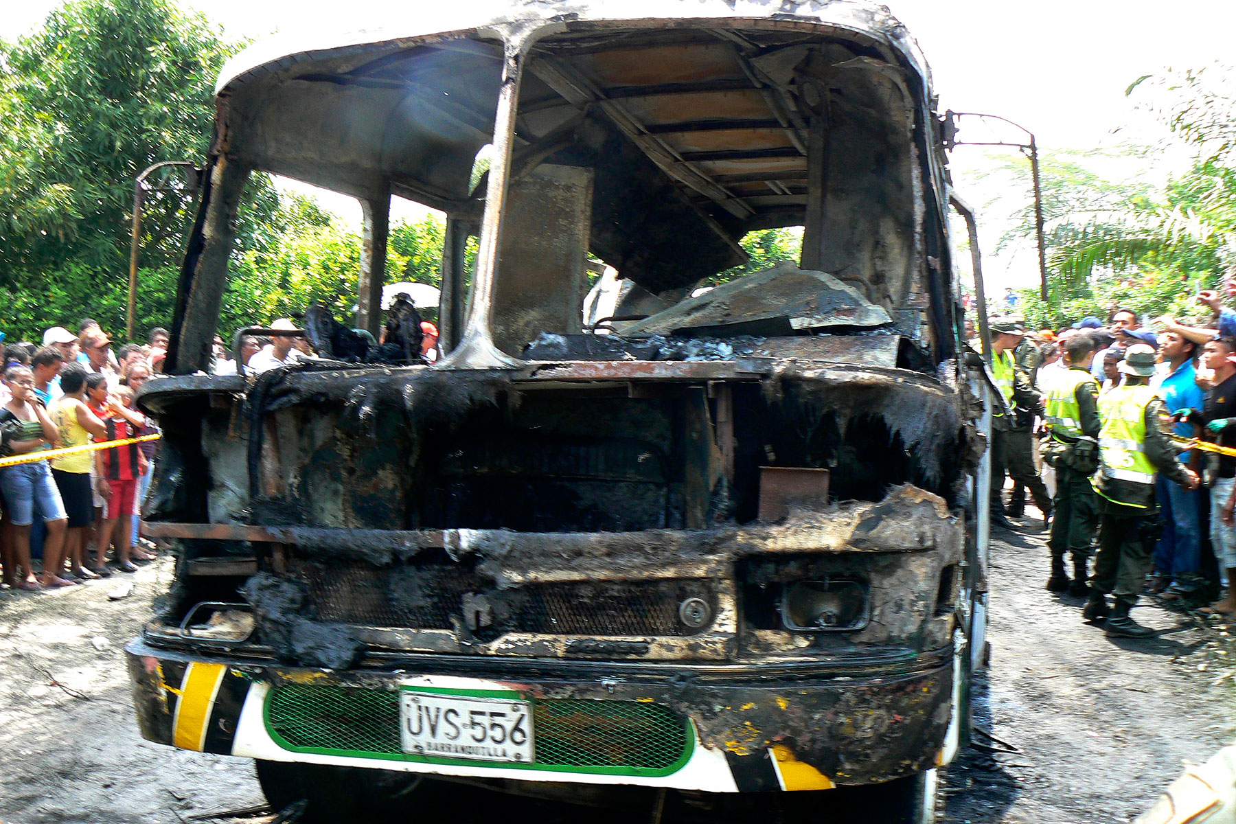 The charred remains of a bus, in which children died in, is seen in Fundacion, northern Colombia, on May 18, 2014