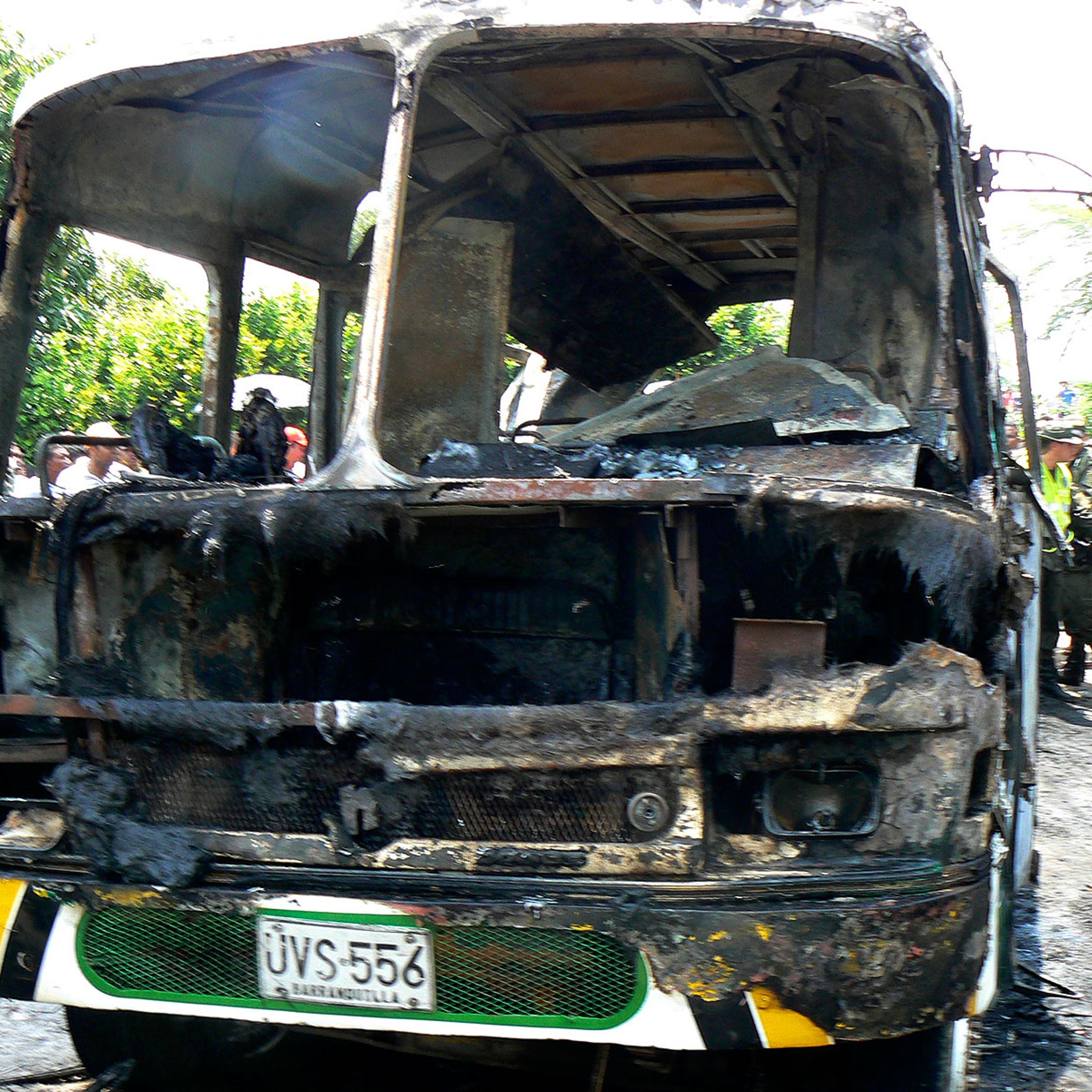 The charred remains of a bus, in which children died in, is seen in Fundacion, northern Colombia, on May 18, 2014