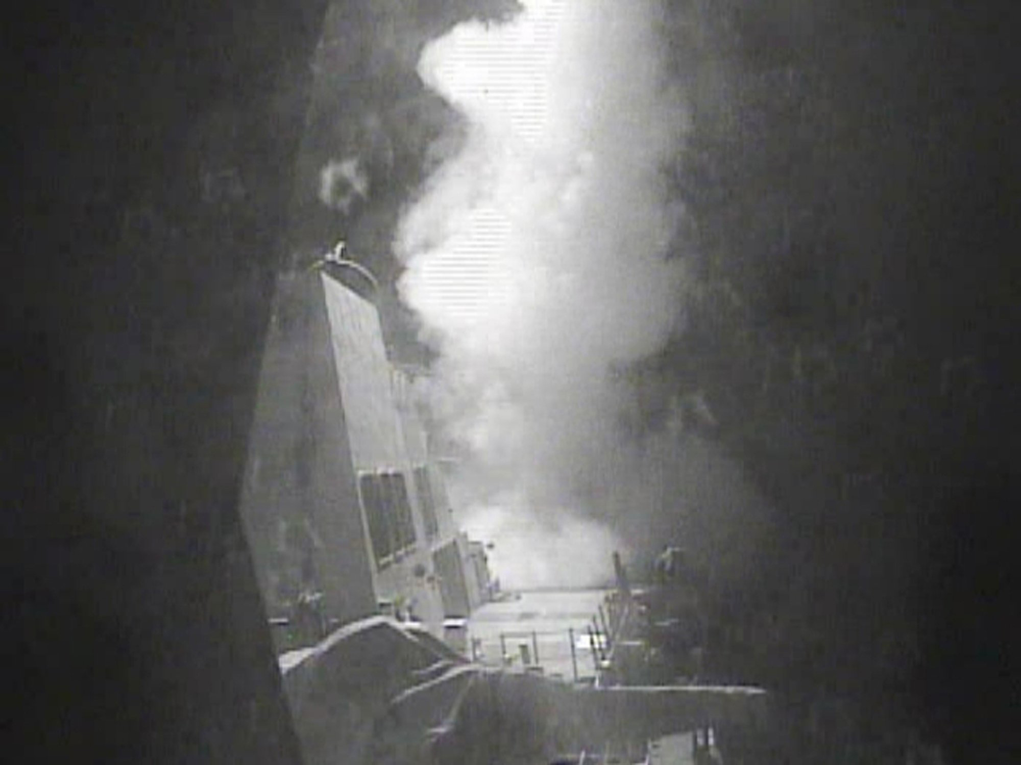In this Thursday Oct. 13 photo released by U.S. Navy, the guided missile destroyer USS Nitze (DDG 94) launches a strike against coastal sites in Houthi-controlled territory on Yemen's Red Sea coast. U.S.-launched Tomahawk cruise missiles destroyed three 