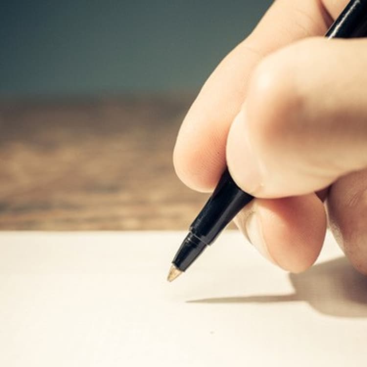 person writing-hand-pen-themuse