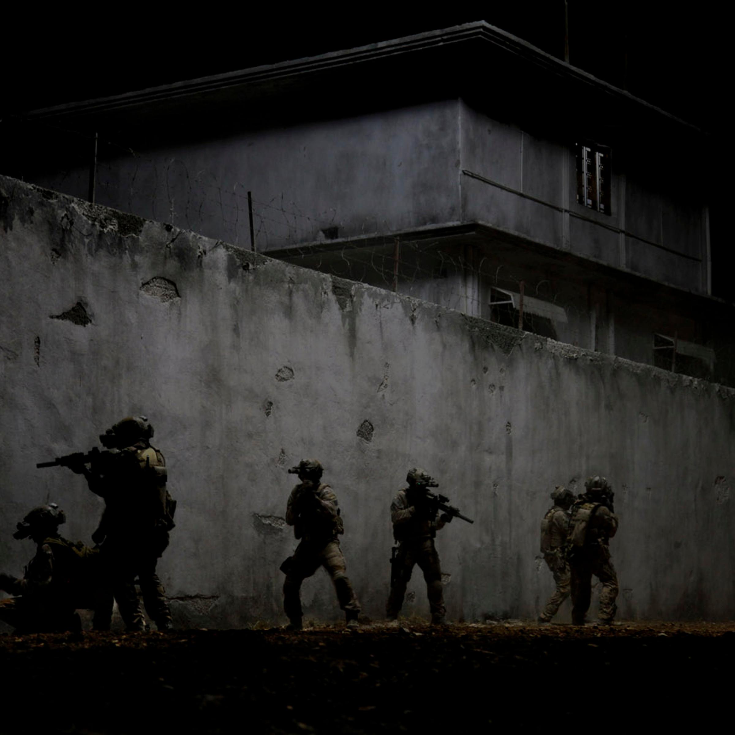 Navy SEALs raid Osama Bin Laden's compound in Zero Dark Thirty.