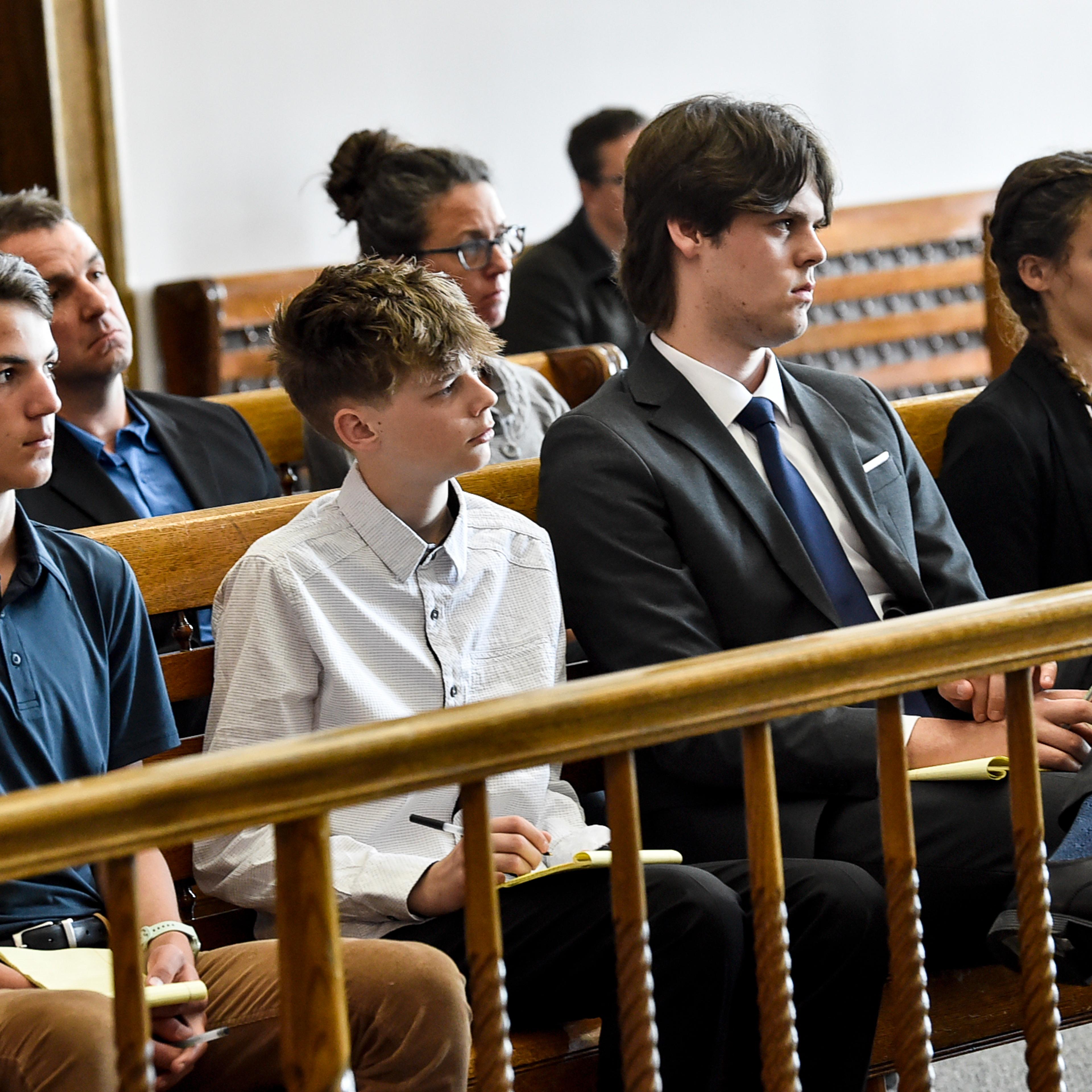 Plaintiffs Mica, 14; Badge 15, Lander 18, and Taleah, 19, listen to arguments during a status hearing on May 12, 2023, in Helena, Mont., for a case that they and other Montana youth filed against the state arguing Montana officials are not meeting their constitutional obligations to protect residents from climate change. The first-of-its-kind trial begins Monday, June 12, 2023, before District Court Judge Kathy Seeley in Helena. It is scheduled to last for two weeks. (Thom Bridge/Independent Record via AP)