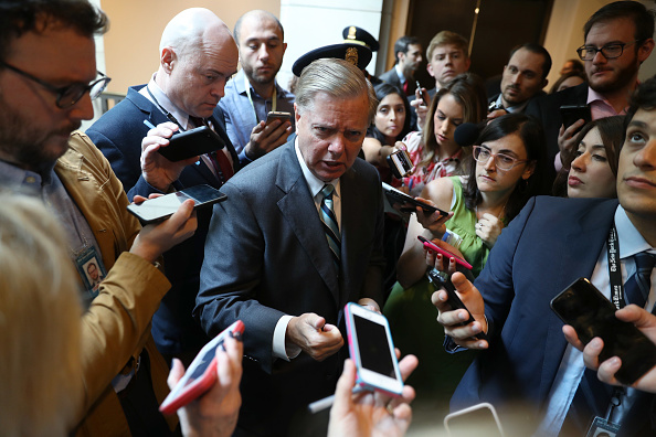Senator Lindsey Graham speaks to members of the media while arriving at the Office of Senate Security on Capitol Hill in Washington, D.C., U.S., on Thursday, Oct. 4, 2018.
