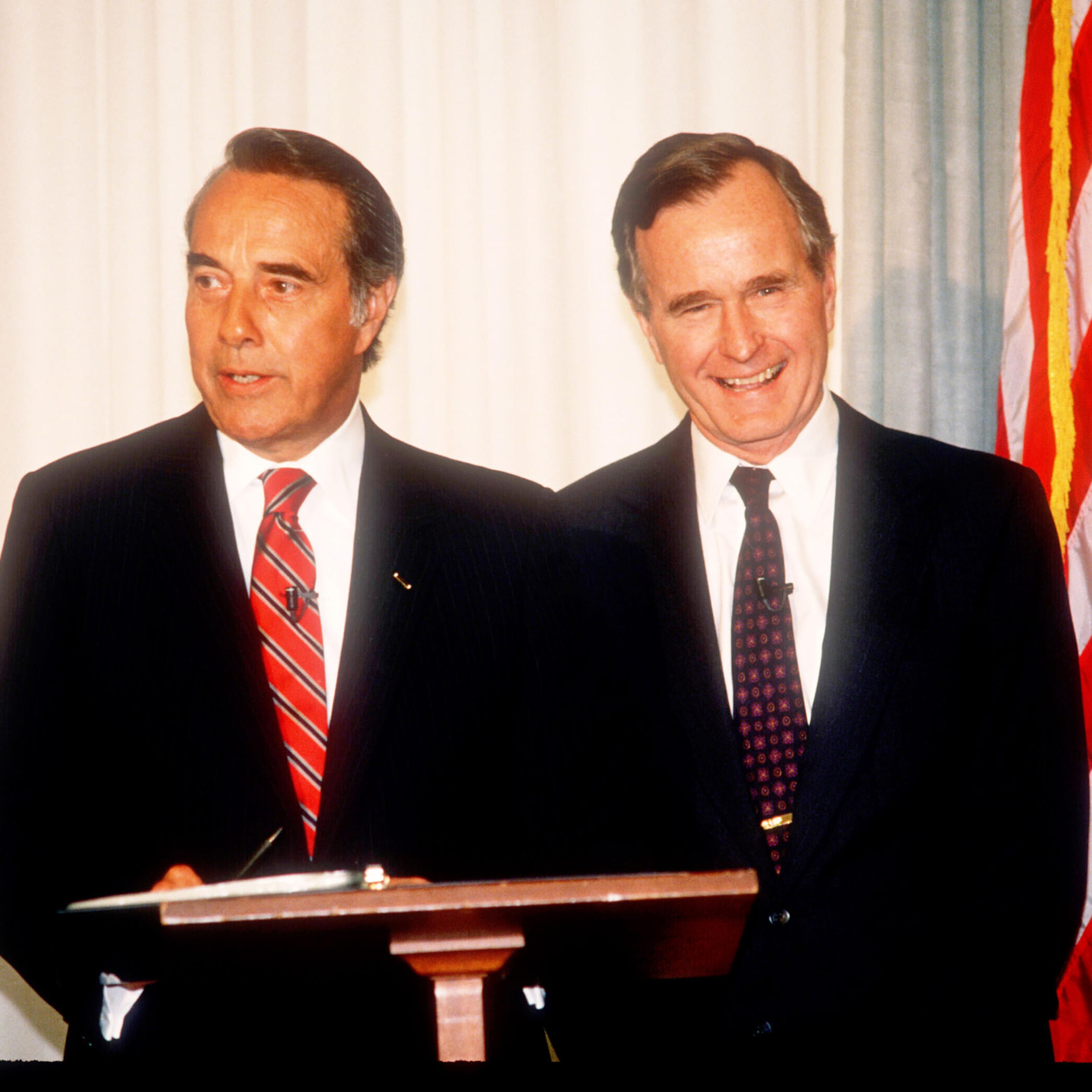 George Herbert Walker Bush stands with Bob Dole in Washington, D.C., on April 15, 1988.