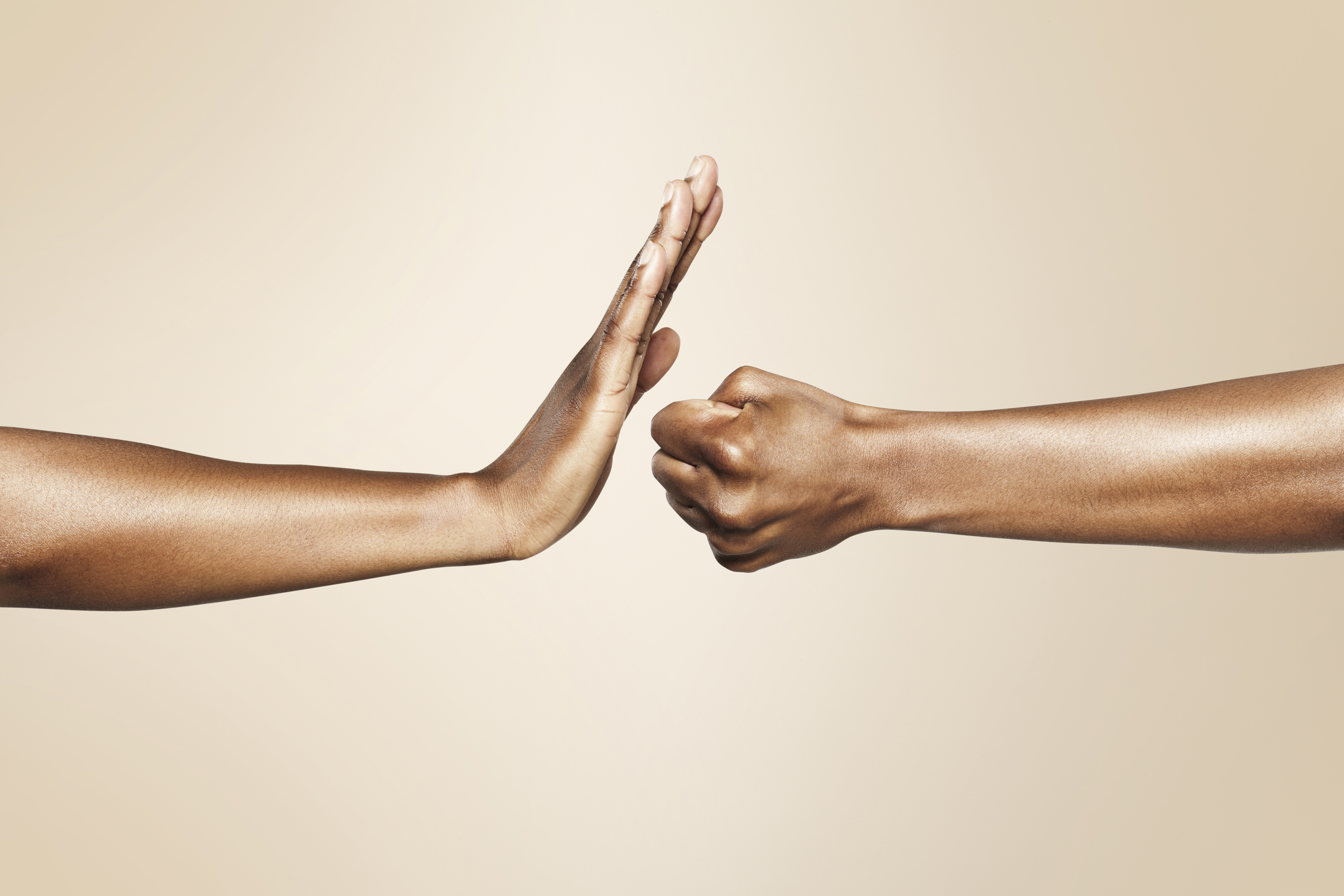 hands forming signs for offense and defense