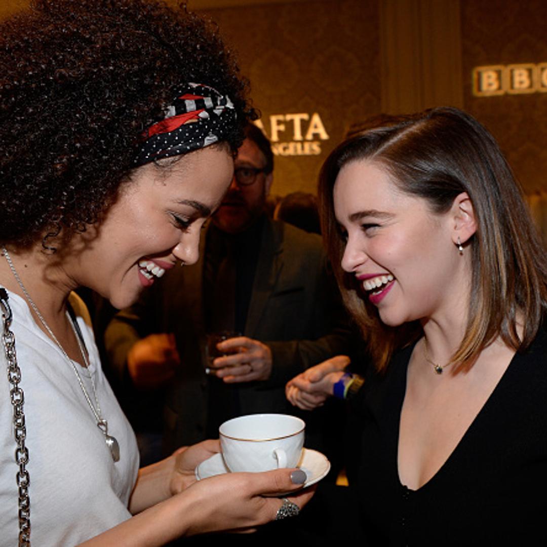 Nathalie Emmanuel and Emilia Clarke attend the BAFTA Los Angeles Awards Season Tea at Four Seasons Hotel Los Angeles at Beverly Hills on January 9, 2016 in Los Angeles, California.