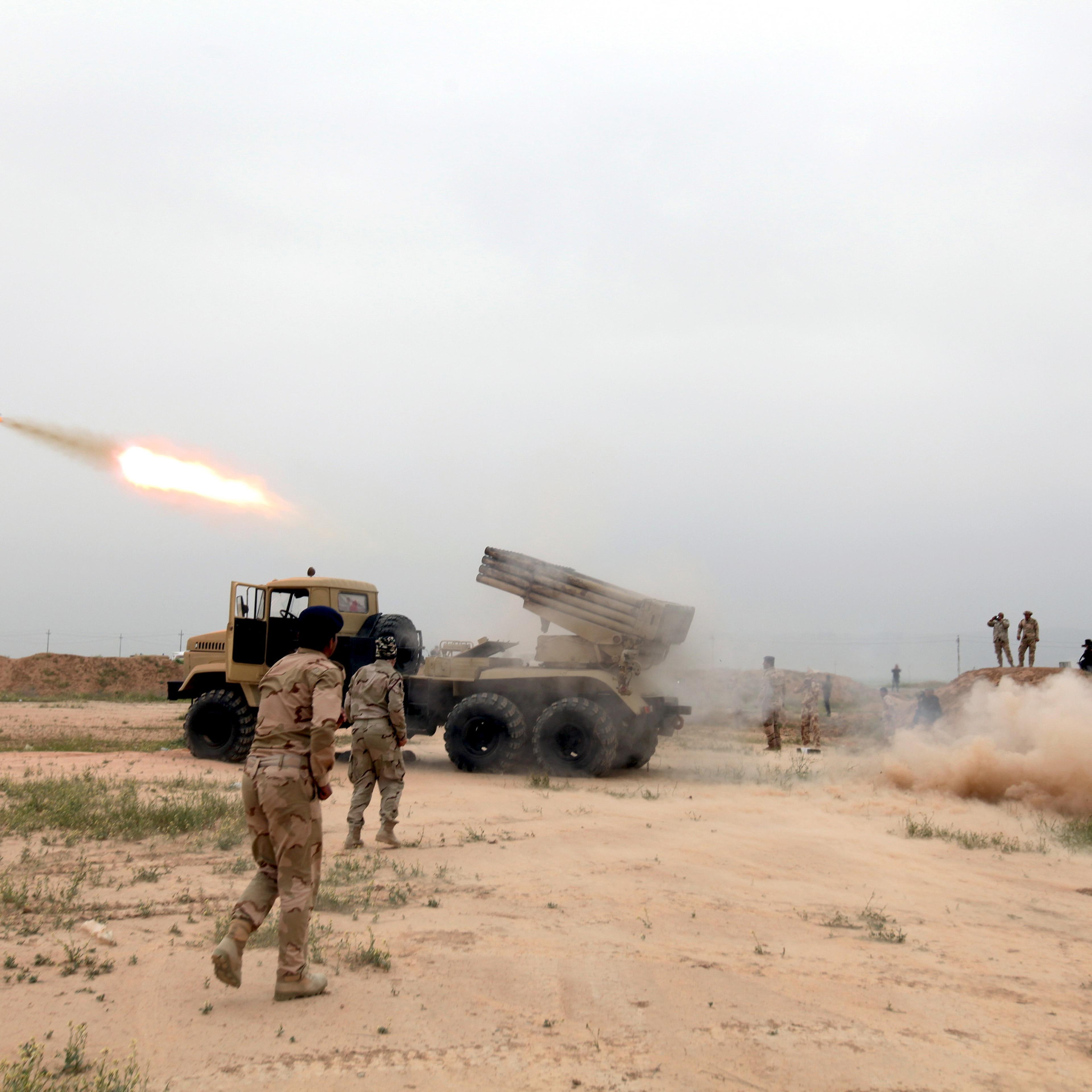 Iraqi soldiers fire a rocket toward Islamic State militants on the outskirt of the Makhmour south of Mosul