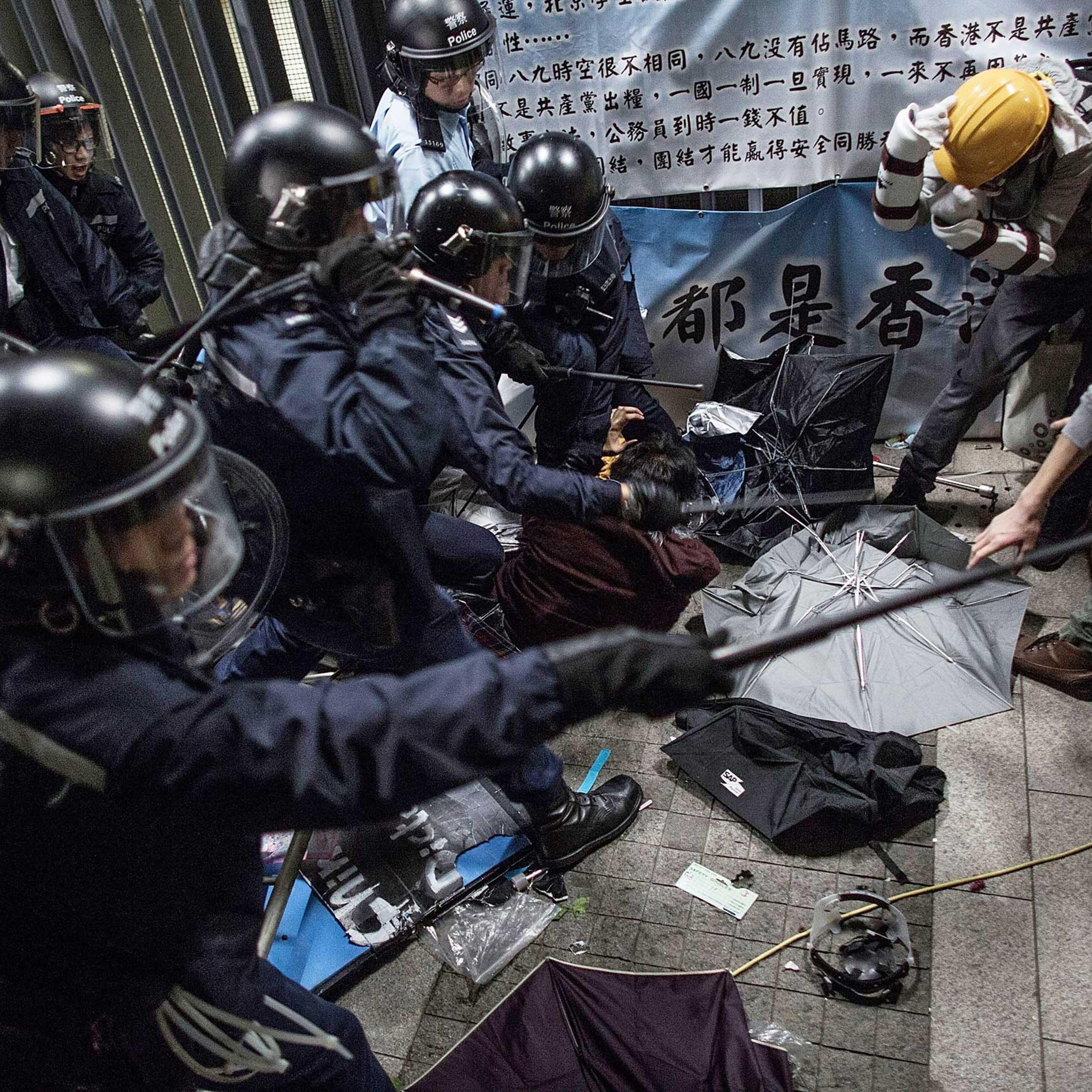 Police officers disperse pro-democracy protesters outside the Legislative Council building after clashes with pro-democracy activists on Nov. 19, 2014 in Hong Kong.