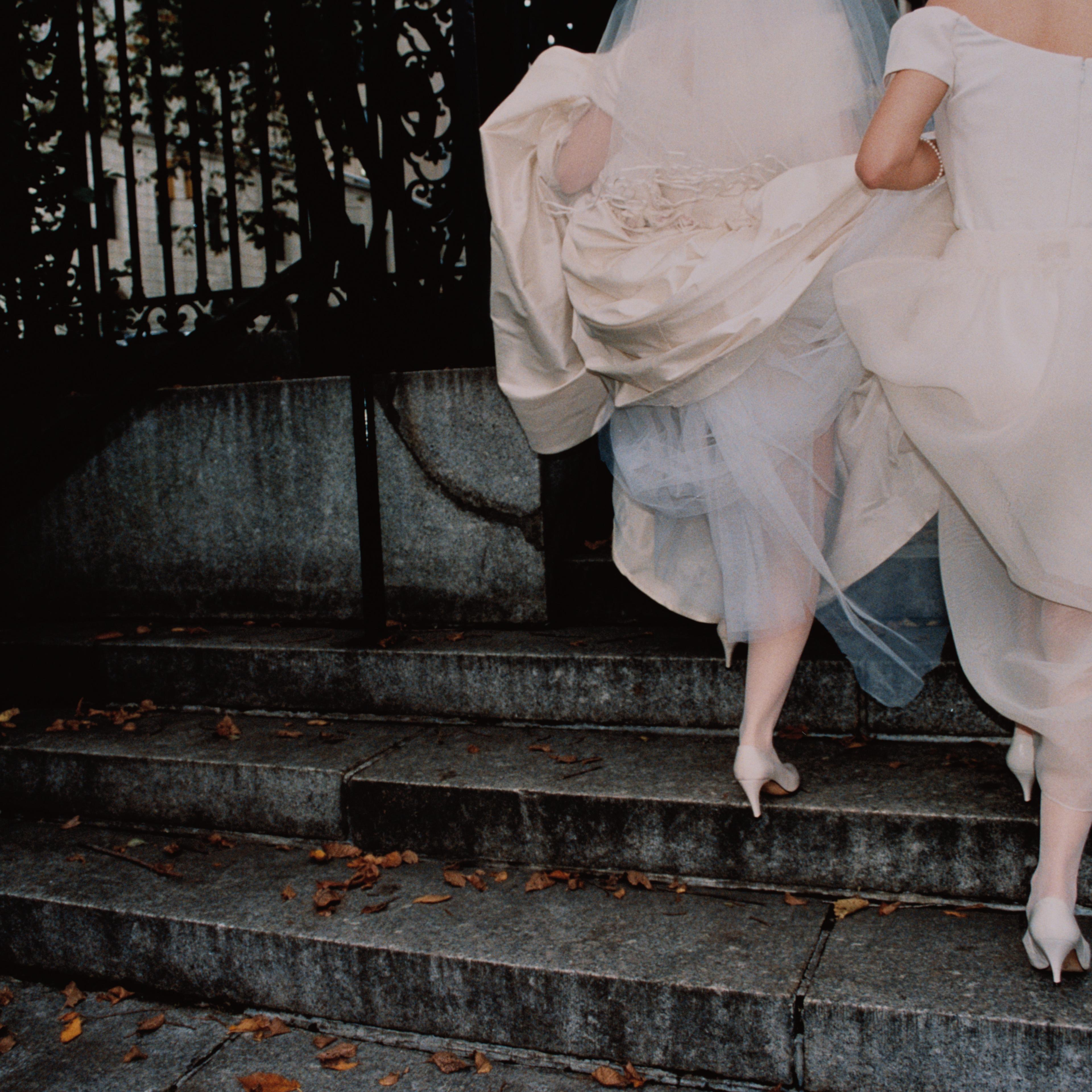 Bride and Bridesmaid on Steps