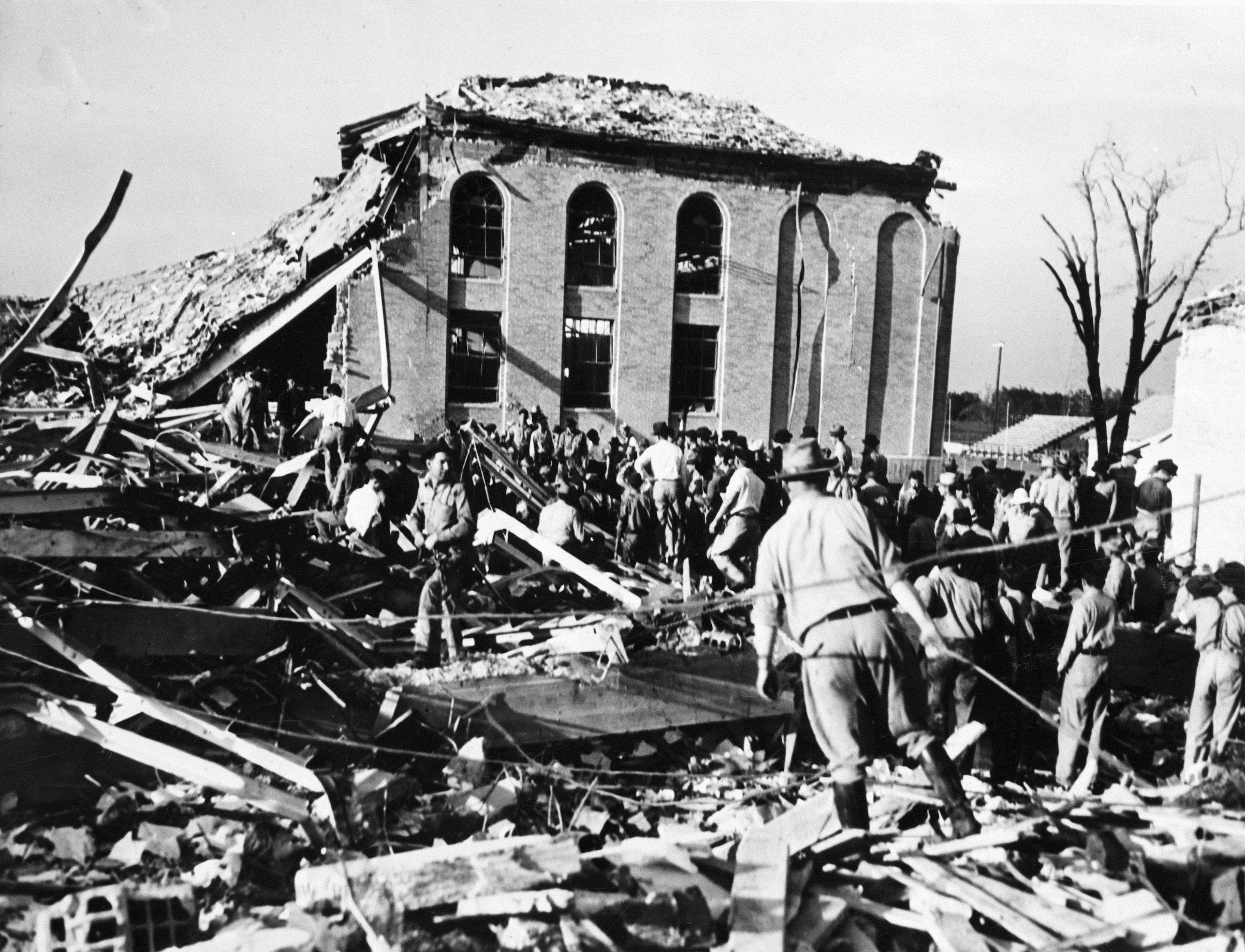 Rescue Workers Probe High School Ruins