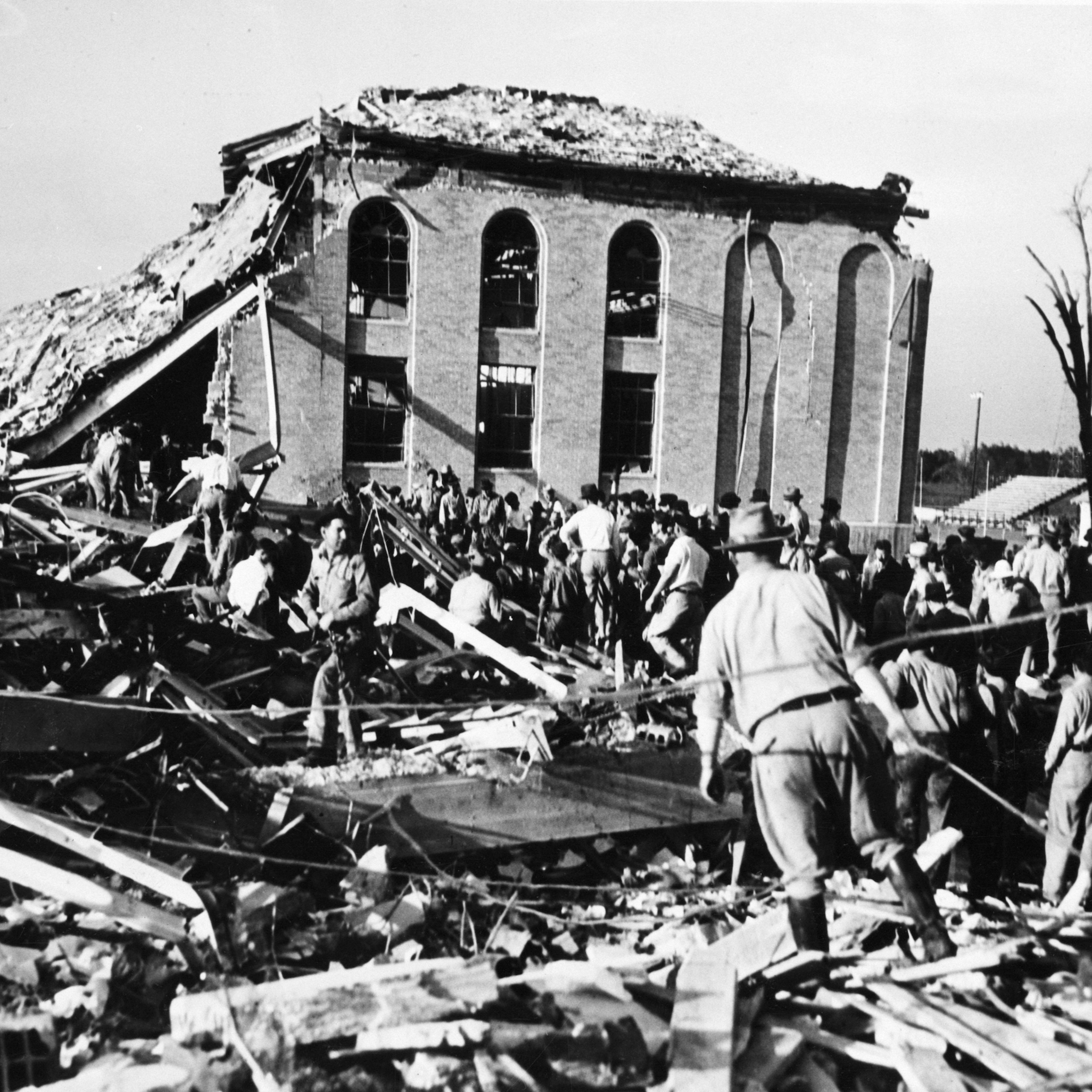 Rescue Workers Probe High School Ruins