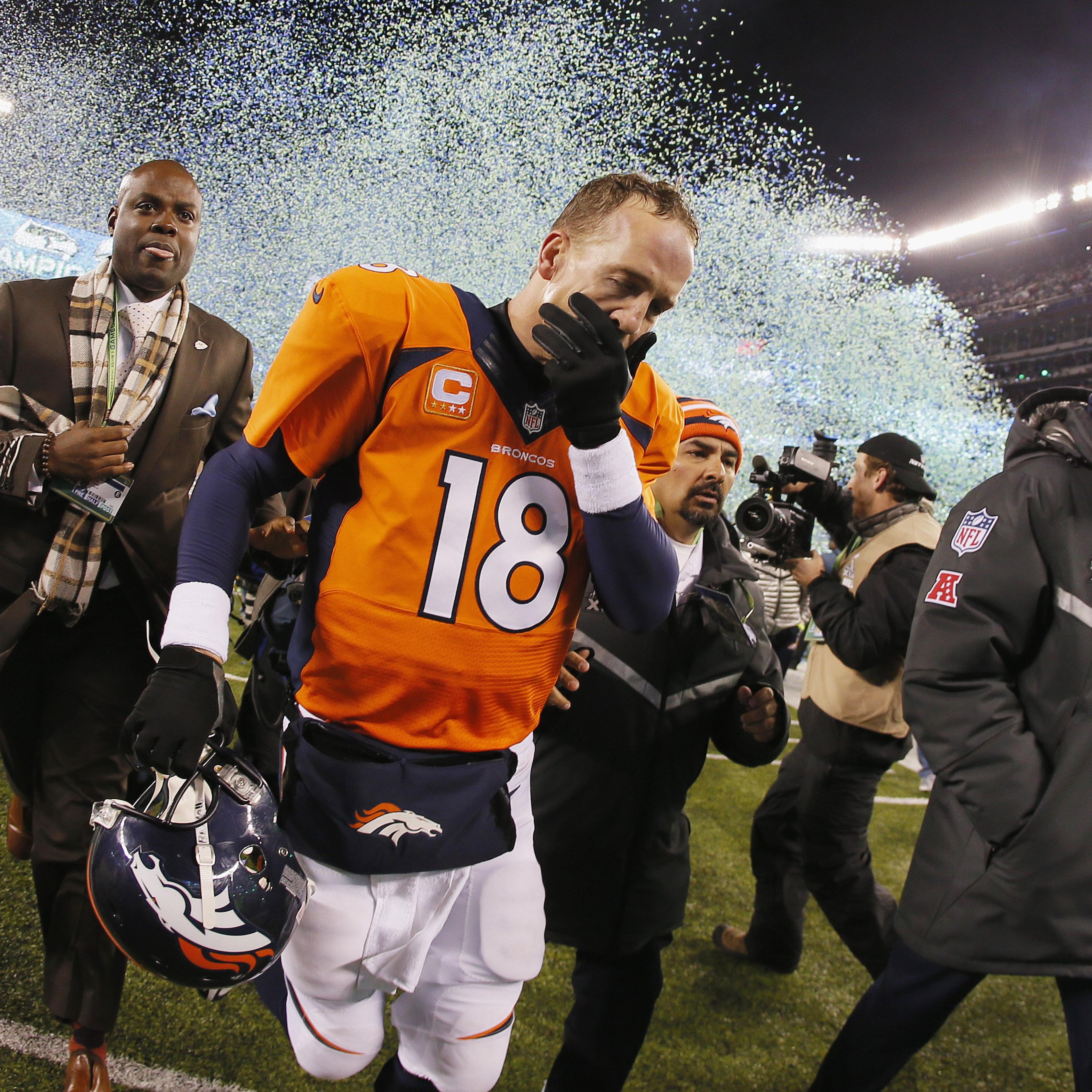 Quarterback Peyton Manning of the Denver Broncos reacts as he walks off the field after their 43-8 loss to the Seattle Seahawks during Super Bowl XLVIII.