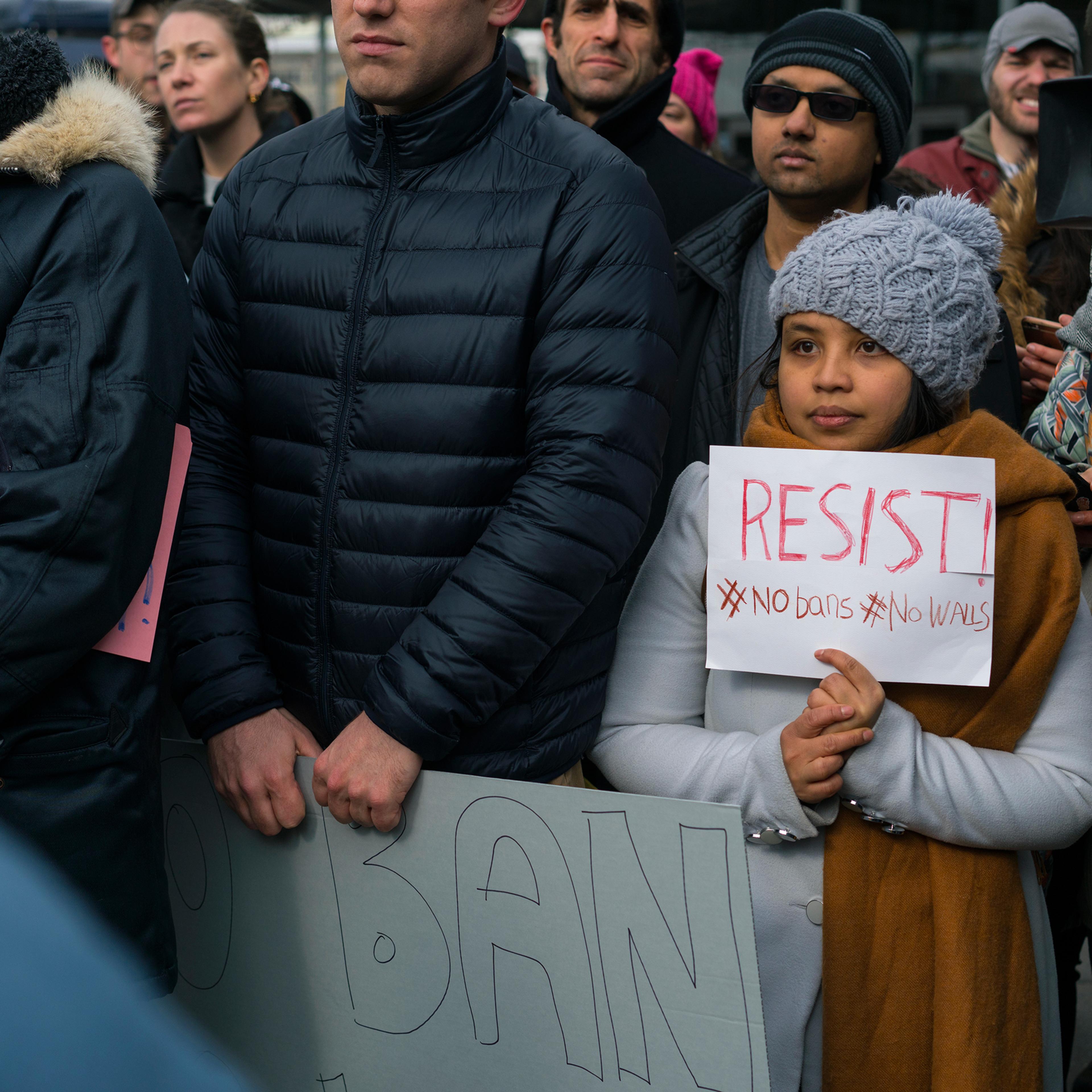 Protesters assemble at John F. Kennedy International Airport in New York, Saturday, Jan. 28, 2017 after two Iraqi refugees were detained while trying to enter the country. On Friday, Jan. 27, President Donald Trump signed an executive order suspending al