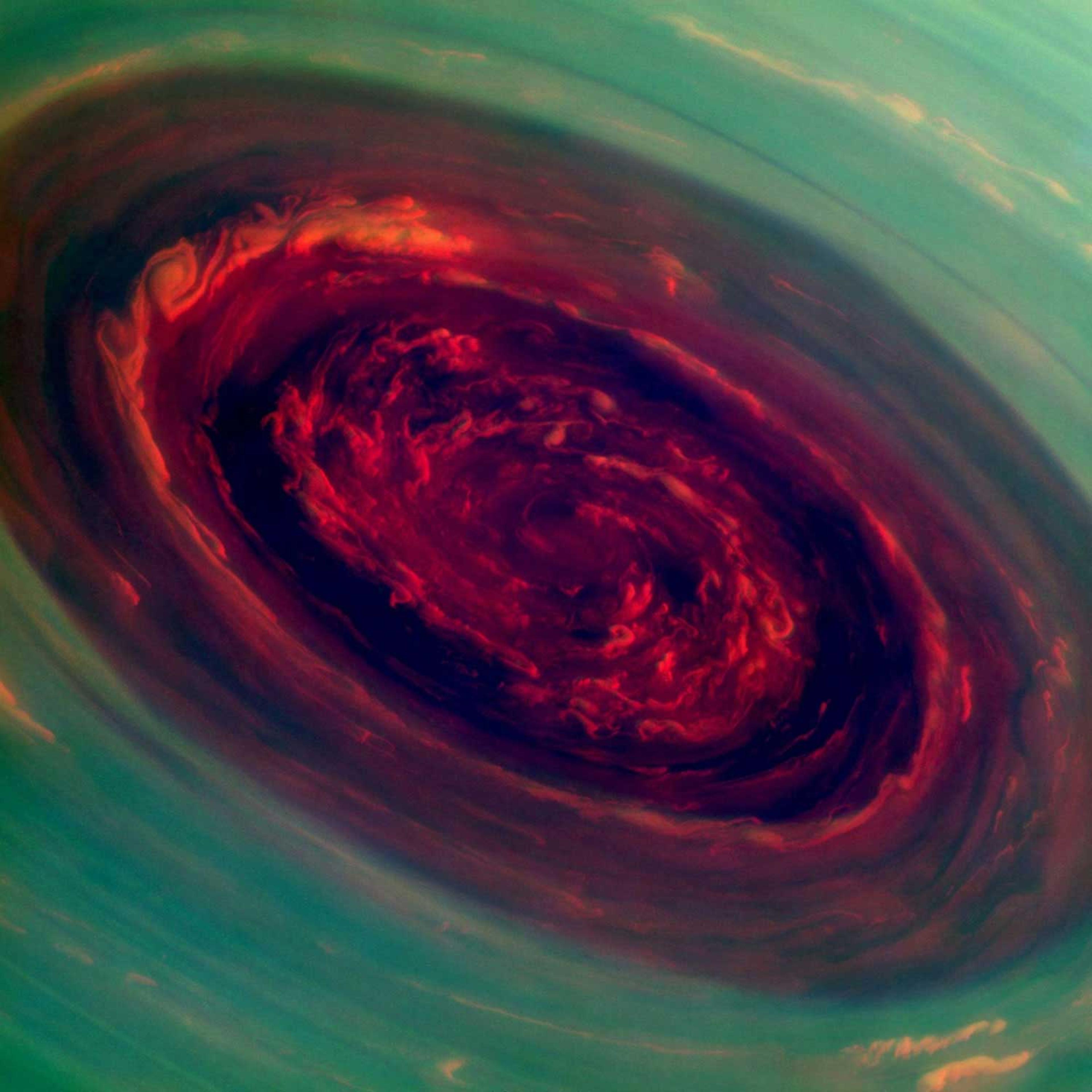 The vortex of Saturn's north polar storm is seen in this false-color image taken from NASA's Cassini spacecraft. The eye is an estimated 1,250 miles across with cloud speeds as fast as 330 miles per hour.