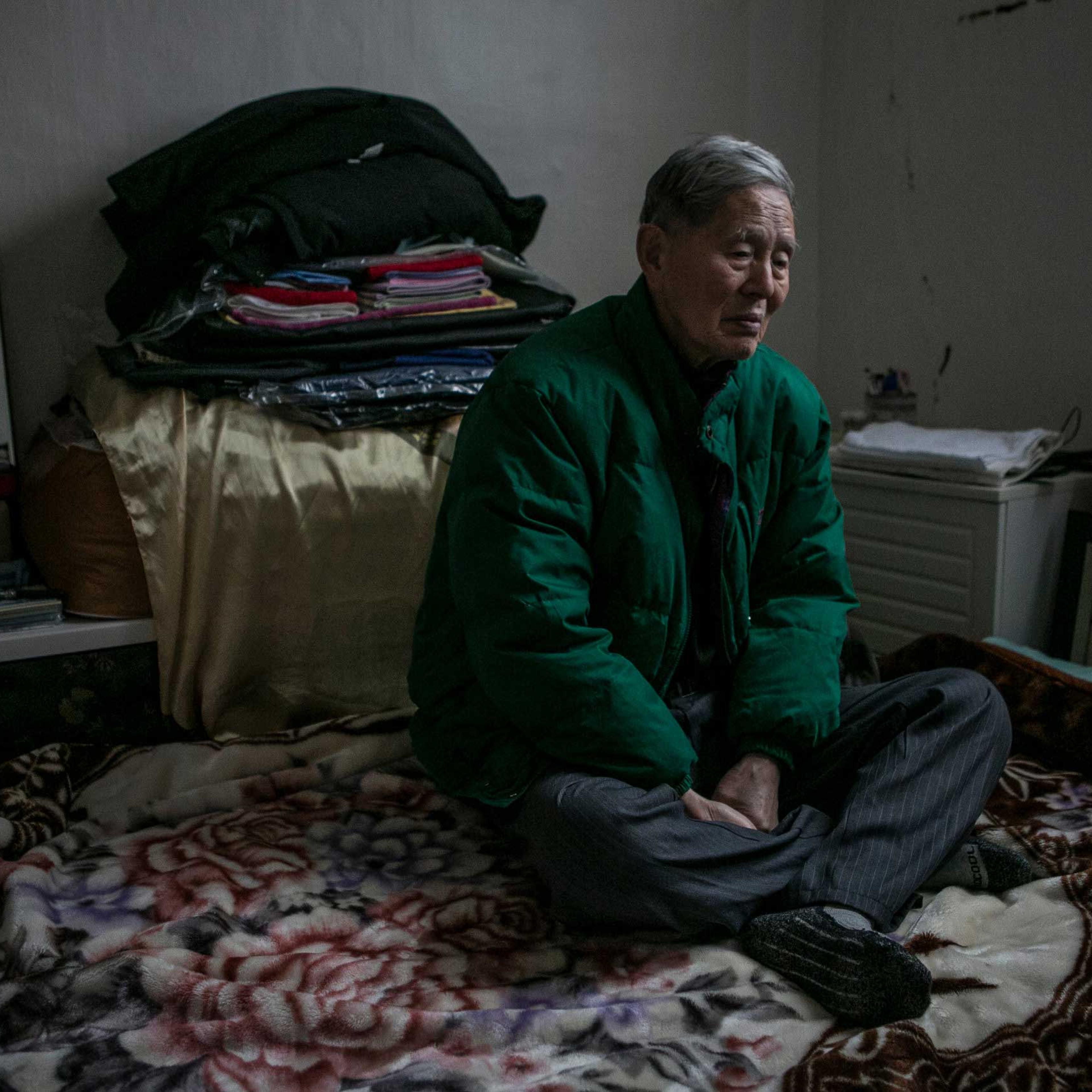 Ham Hak-joon sits in his one-room home on top of the hill in Jongro District, Seoul, South Korea in December 27, 2014. Ham, an 86-year-old man who lives by himself, has been out of contact with two of his grown-up children for more than 30 years. He has