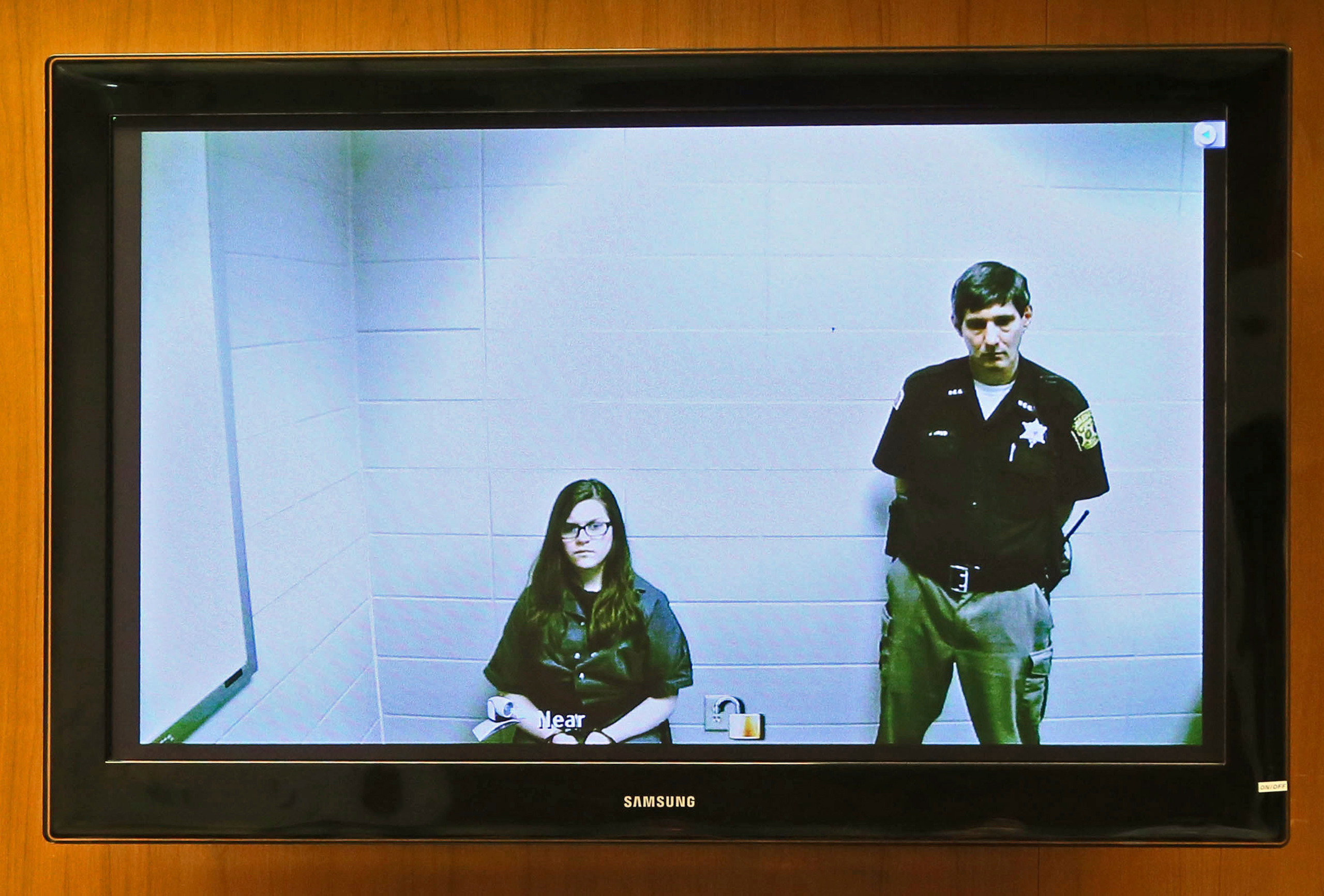 Anissa Weier, left, appears via video link from the Washington County Secure Detention Center where she is being held, during a hearing in Waukesha County Court, Friday, Nov. 11,2016, in Waukesha, Wis. According to prosecutors, Weier and Morgan Geyser st