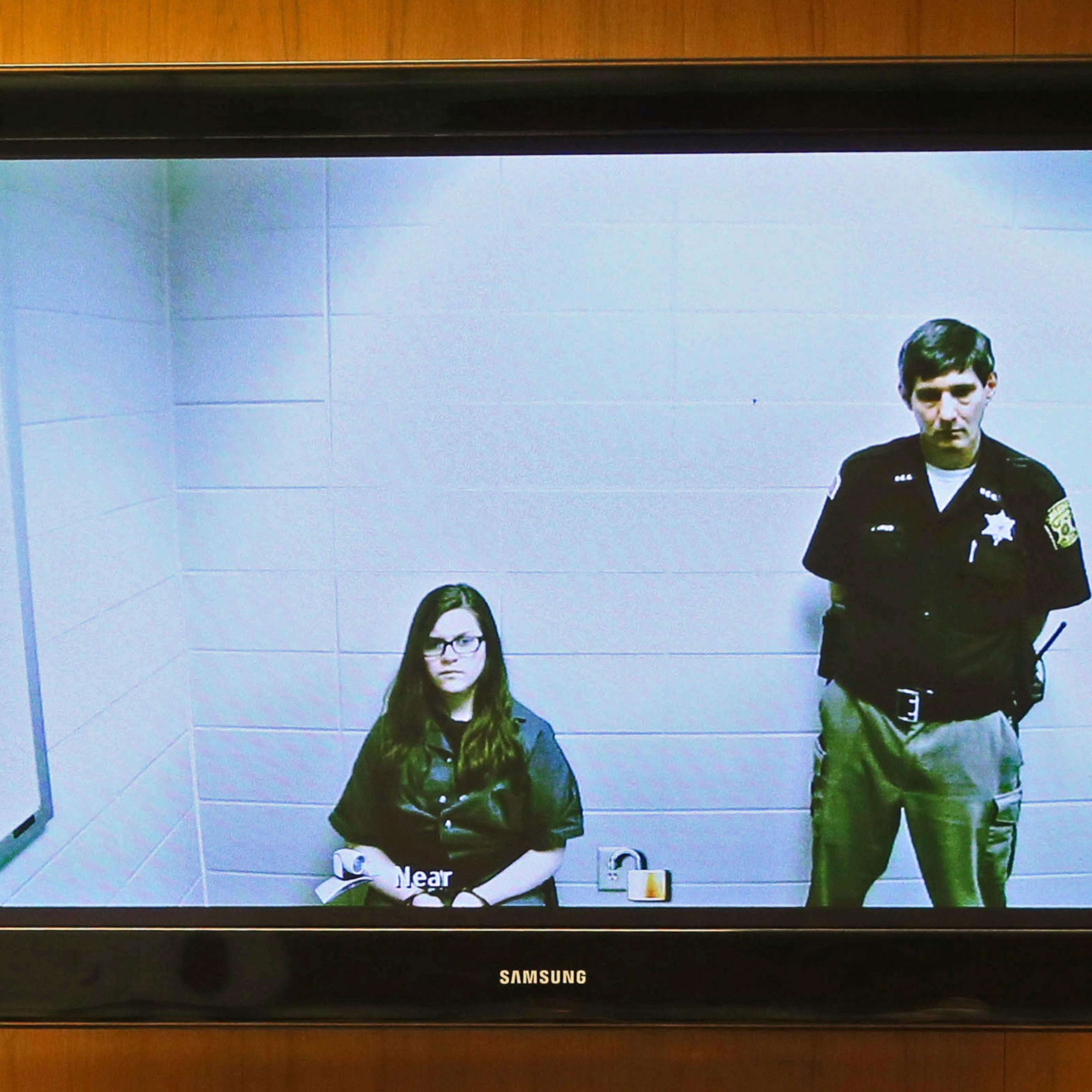 Anissa Weier, left, appears via video link from the Washington County Secure Detention Center where she is being held, during a hearing in Waukesha County Court, Friday, Nov. 11,2016, in Waukesha, Wis. According to prosecutors, Weier and Morgan Geyser st