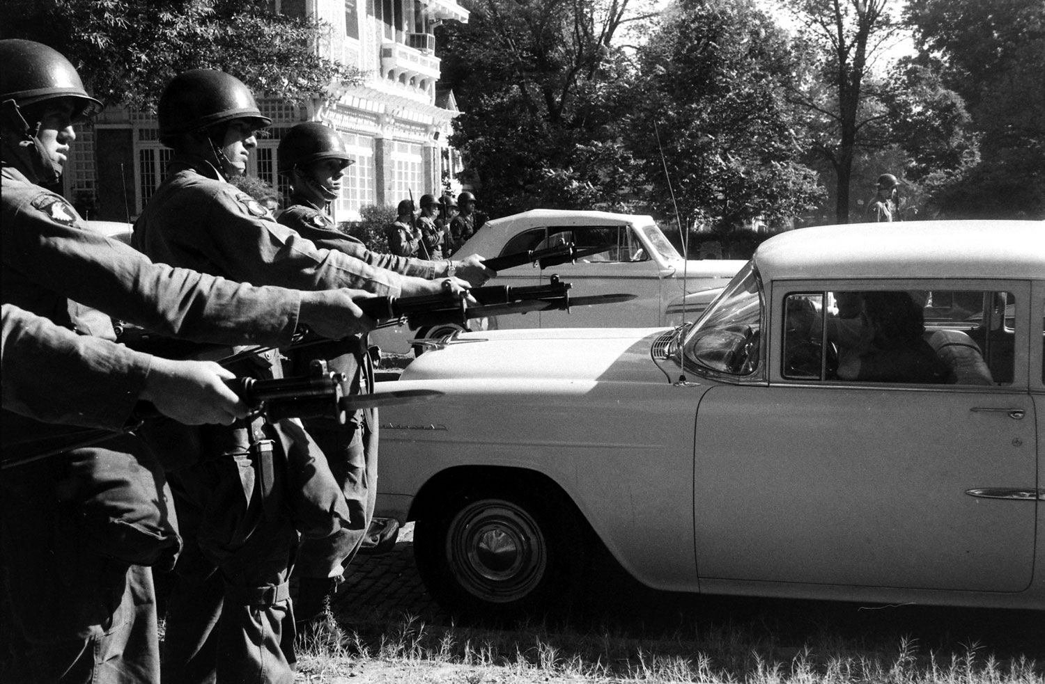 Paratroopers from the 101st Airborne stand guard outside Little Rock Central High School, September 1957.