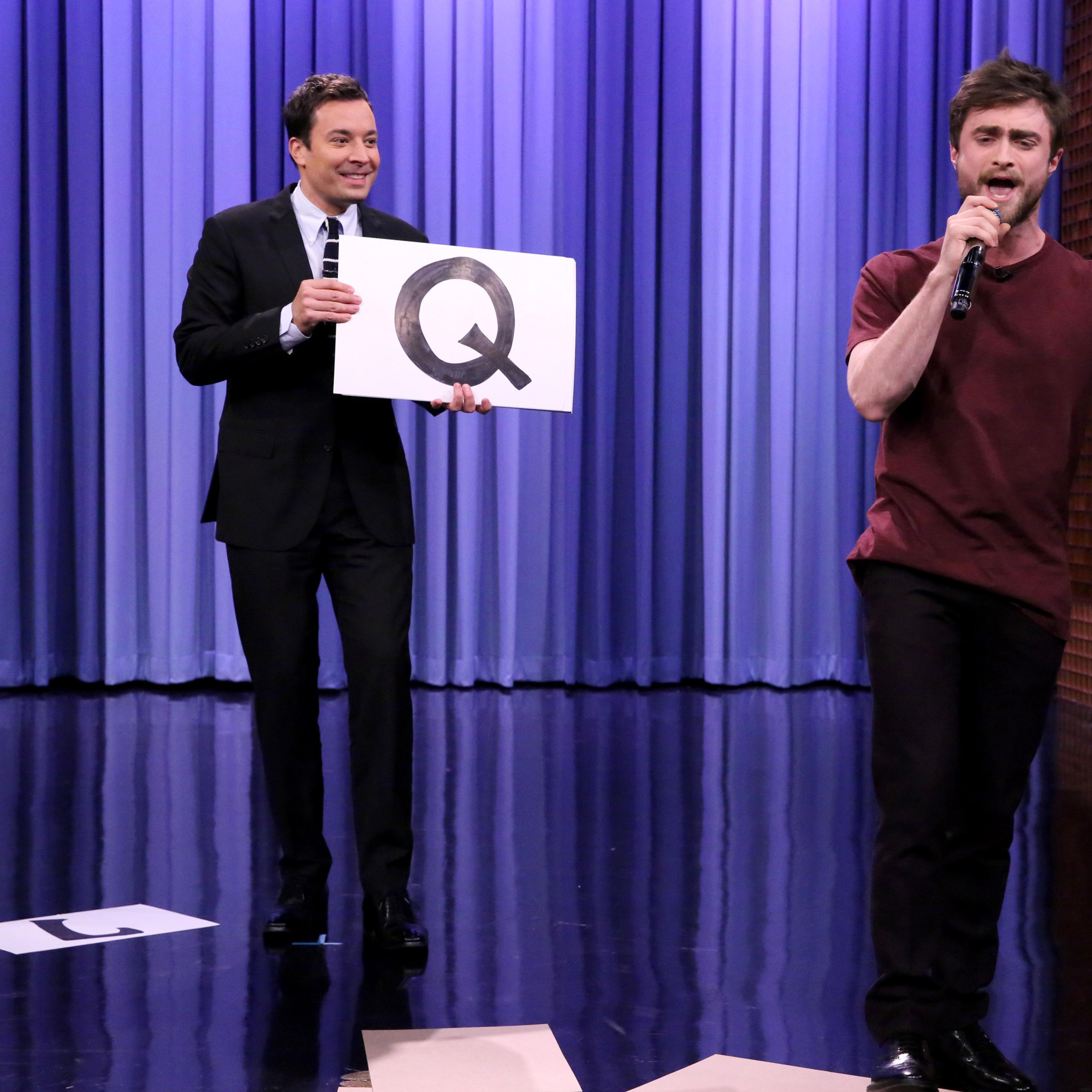 THE TONIGHT SHOW STARRING JIMMY FALLON -- Episode 0150 -- Pictured: (l-r) Host Jimmy Fallon watches as actor Daniel Radcliffe performs the "Alphabet Aerobics" rap by Blackalicious on October 28, 2014 -- (Photo by: Douglas Gorenstein/NBC/NBCU Photo Bank)