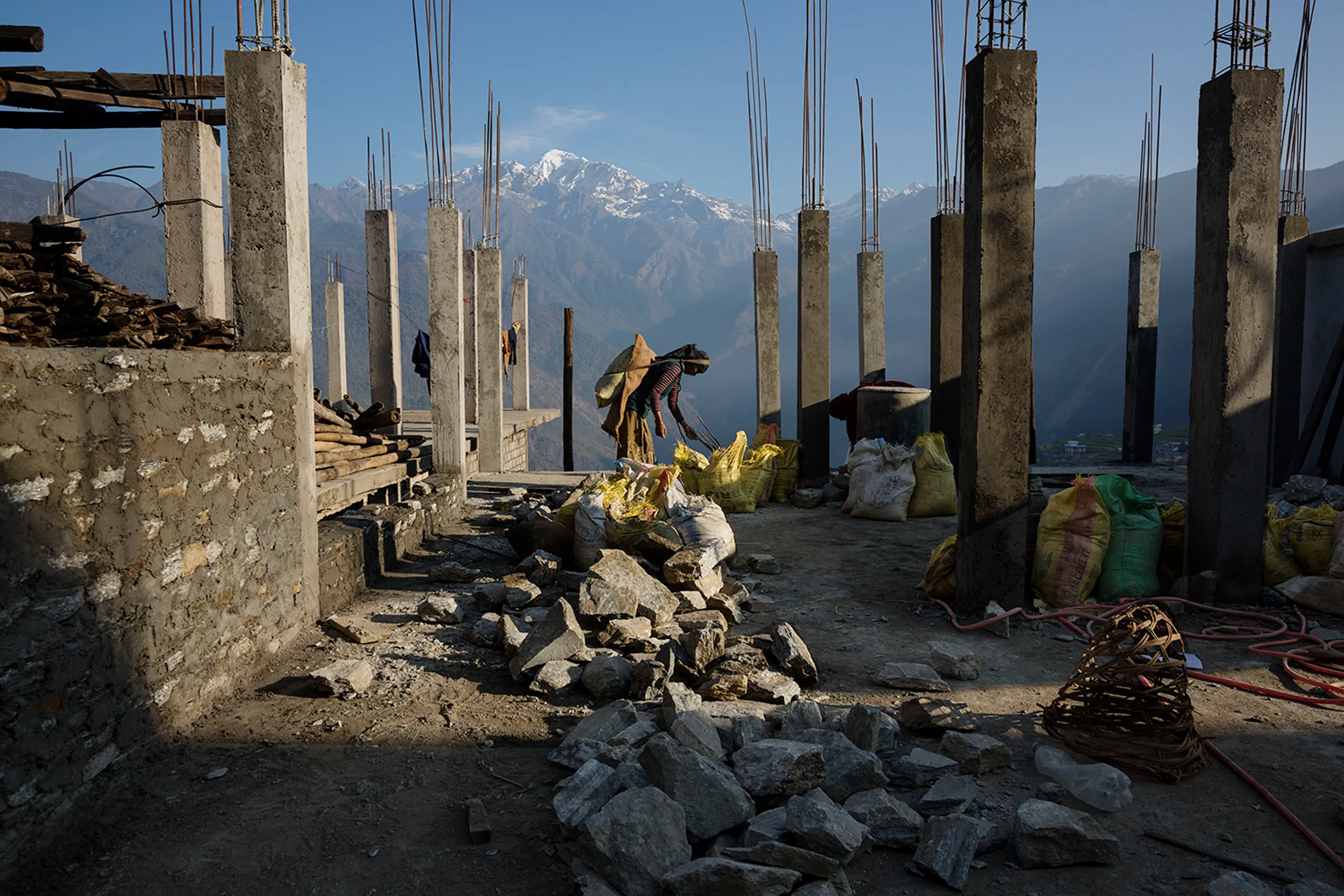 Villagers rebuild houses and pathways in the village of Barpak, in Gorkha district, Nepal, at the epicenter of the April and May 2015 earthquakes which killed 9000 people, April 6, 2016.